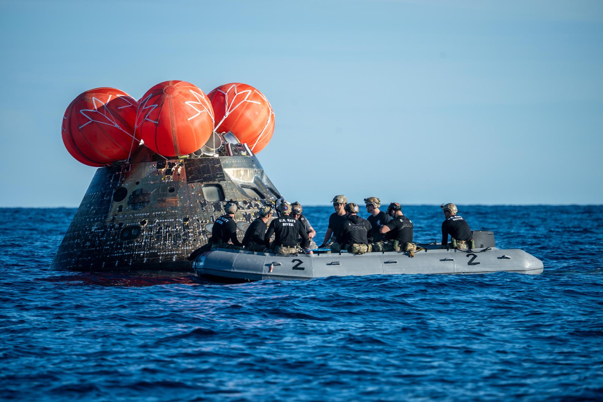 NASA’s Landing and Recovery team, along with U.S. Navy personnel aboard an inflatable raft approach NASA’s Orion spacecraft carrying Artemis II Commander Reid Wiseman, Pilot Victor Glover, and Mission Specialist Christina Koch from NASA, along with Mission Specialist Jeremy Hansen from the CSA (Canadian Space Agency), following splashdown in the Pacific Ocean near San Diego, California, at 5:07 p.m. PDT, (8:07 p.m. EDT) on Friday, April 10, 2026. The Artemis II test flight launched on Wednesday, April 1, from NASA’s Kennedy Space Center in Florida to begin its 10-day journey around the Moon for scientific discovery, economic benefits, and to build on our foundation for the first crewed missions to Mars. NASA’s Landing and Recovery team and the U.S. military are helping the Artemis II crew out of their Orion spacecraft. 