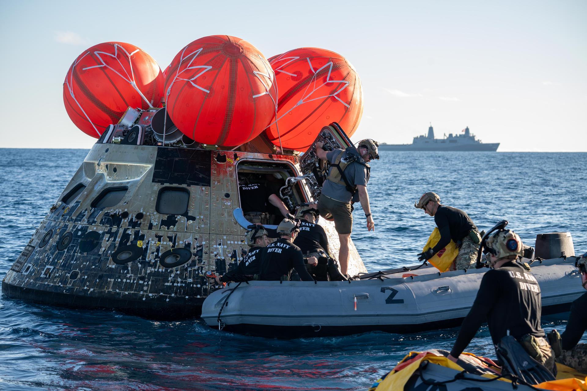 NASA’s Landing and Recovery team, along with U.S. Navy personnel aboard an inflatable raft approach NASA’s Orion spacecraft carrying Artemis II Commander Reid Wiseman, Pilot Victor Glover, and Mission Specialist Christina Koch from NASA, along with Mission Specialist Jeremy Hansen from the CSA (Canadian Space Agency), following splashdown in the Pacific Ocean near San Diego, California, at 5:07 p.m. PDT, (8:07 p.m. EDT) on Friday, April 10, 2026. The Artemis II test flight launched on Wednesday, April 1, from NASA’s Kennedy Space Center in Florida to begin its 10-day journey around the Moon for scientific discovery, economic benefits, and to build on our foundation for the first crewed missions to Mars. NASA’s Landing and Recovery team and the U.S. military are helping the Artemis II crew out of their Orion spacecraft. 