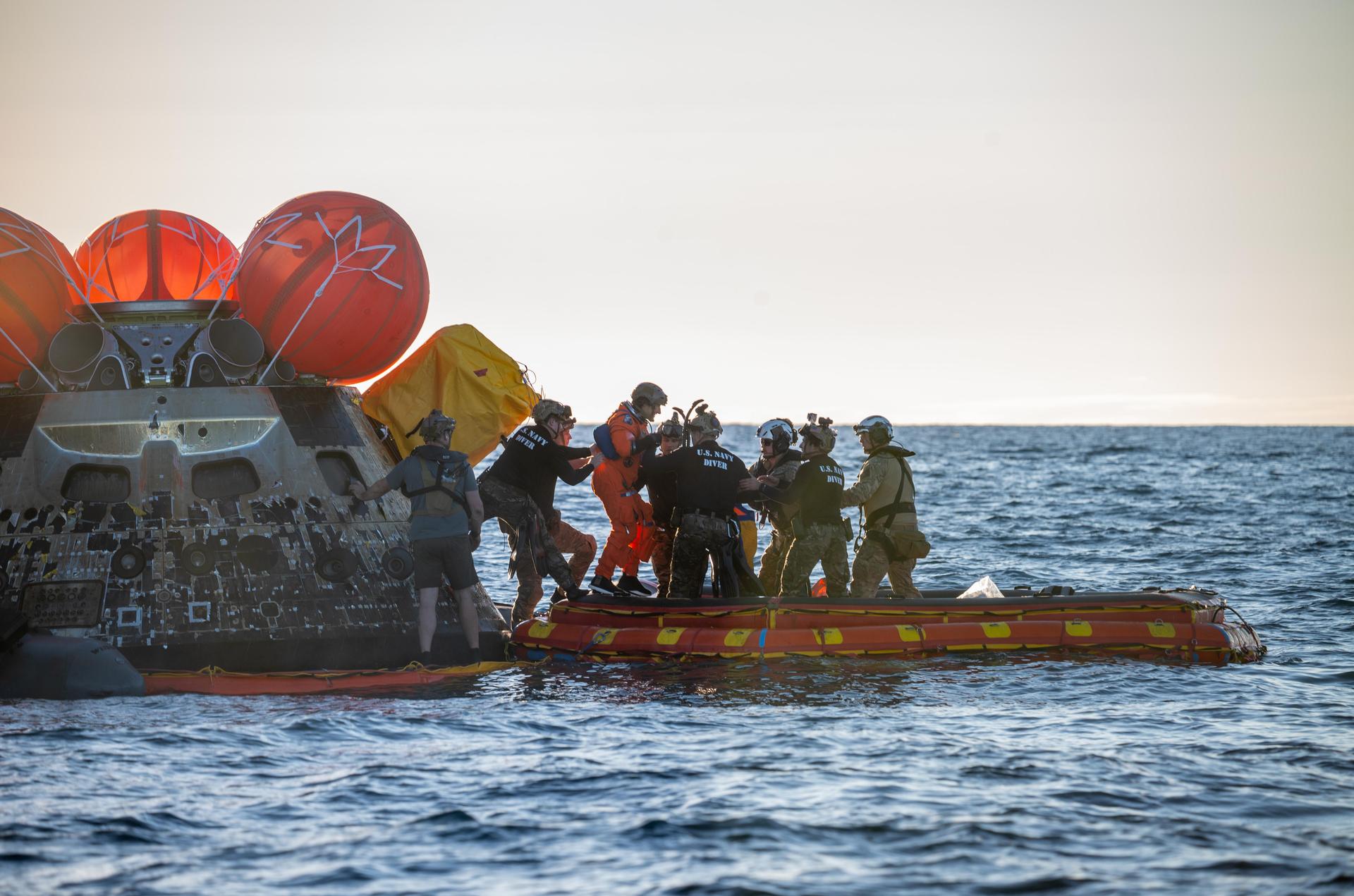 Artemis II Mission Specialist Christina Koch, from NASA, is extracted from NASA’s Orion spacecraft and loaded onto an inflatable raft, called the front porch, following splashdown in the Pacific Ocean near San Diego, California, at 5:07 p.m. PDT, (8:07 p.m. EDT) on Friday, April 10, 2026. Koch and the other Artemis II crew will be taken to USS John P. Murtha to be routinely examined while NASA’s Landing and Recovery team and the U.S. Navy recover Orion and secure it in the well deck of the USS John P. Murtha. The Artemis II test flight launched on Wednesday, April 1, from NASA’s Kennedy Space Center in Florida to begin its 10-day journey around the Moon for scientific discovery, economic benefits, and to build on our foundation for the first crewed missions to Mars.