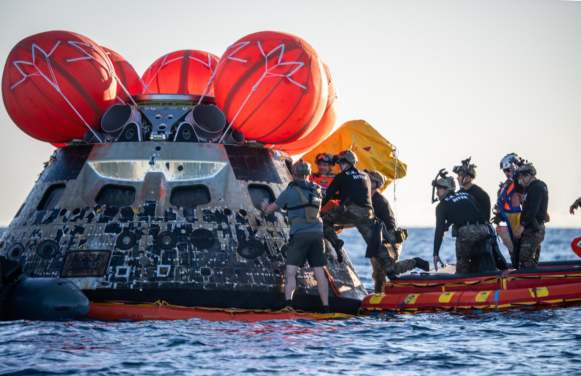 Artemis II Commander Reid Wiseman, from NASA, is extracted from NASA’s Orion spacecraft and loaded onto an inflatable raft, called the front porch, following splashdown in the Pacific Ocean near San Diego, California, at 5:07 p.m. PDT, (8:07 p.m. EDT) on Friday, April 10, 2026. Koch and the other Artemis II crew will be taken to USS John P. Murtha to be routinely examined while NASA’s Landing and Recovery team and the U.S. Navy recover Orion and secure it in the well deck of the USS John P. Murtha. The Artemis II test flight launched on Wednesday, April 1, from NASA’s Kennedy Space Center in Florida to begin its 10-day journey around the Moon for scientific discovery, economic benefits, and to build on our foundation for the first crewed missions to Mars.