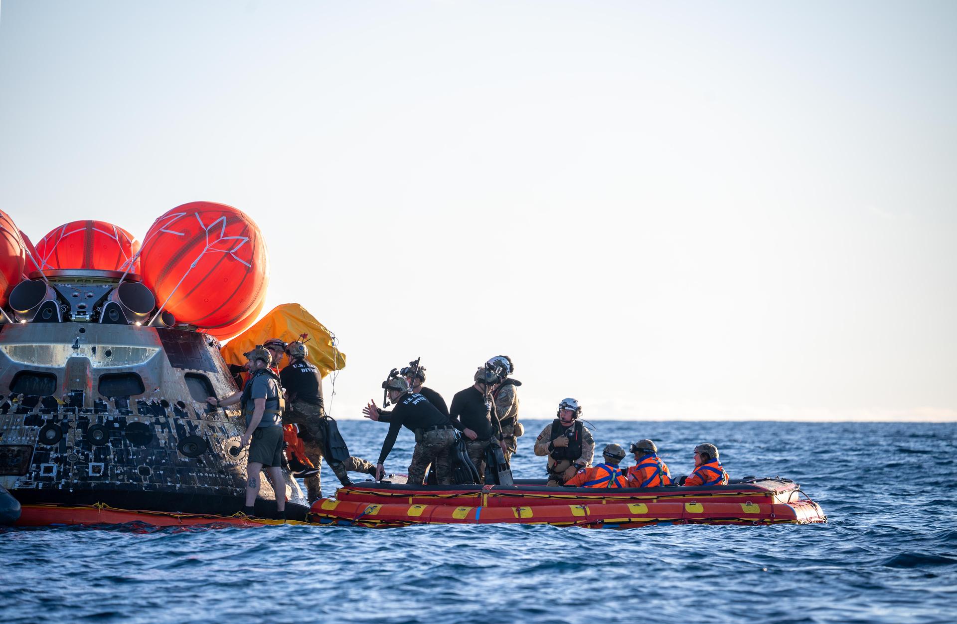 Artemis II Commander Reid Wiseman, from NASA, is extracted from NASA’s Orion spacecraft and loaded onto an inflatable raft, called the front porch, following splashdown in the Pacific Ocean near San Diego, California, at 5:07 p.m. PDT, (8:07 p.m. EDT) on Friday, April 10, 2026. Koch and the other Artemis II crew will be taken to USS John P. Murtha to be routinely examined while NASA’s Landing and Recovery team and the U.S. Navy recover Orion and secure it in the well deck of the USS John P. Murtha. The Artemis II test flight launched on Wednesday, April 1, from NASA’s Kennedy Space Center in Florida to begin its 10-day journey around the Moon for scientific discovery, economic benefits, and to build on our foundation for the first crewed missions to Mars.