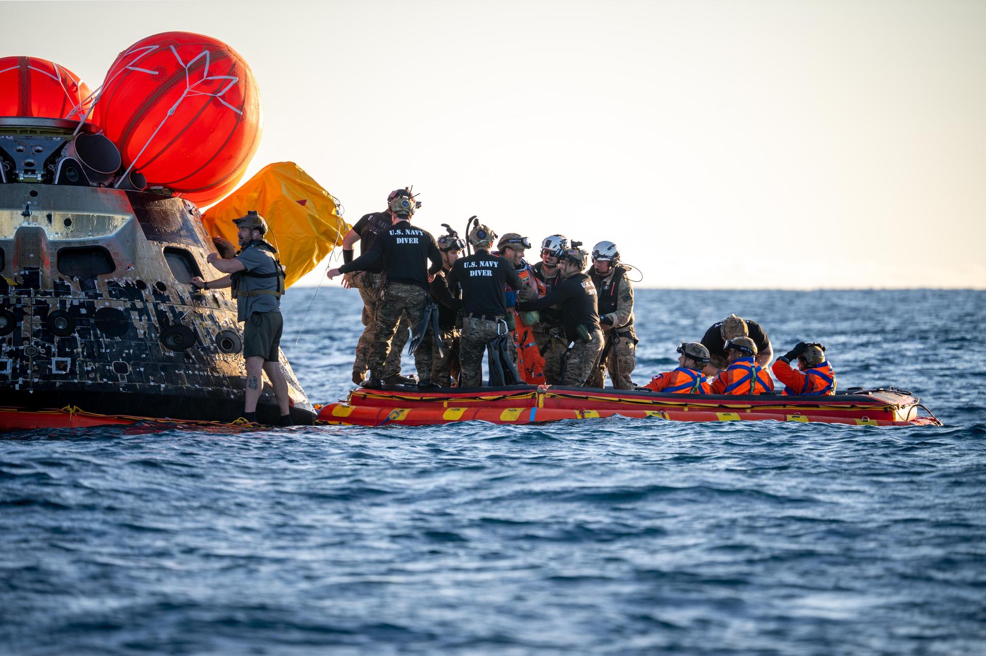 Artemis II Commander Reid Wiseman, from NASA, is extracted from NASA’s Orion spacecraft and loaded onto an inflatable raft, called the front porch, following splashdown in the Pacific Ocean near San Diego, California, at 5:07 p.m. PDT, (8:07 p.m. EDT) on Friday, April 10, 2026. Koch and the other Artemis II crew will be taken to USS John P. Murtha to be routinely examined while NASA’s Landing and Recovery team and the U.S. Navy recover Orion and secure it in the well deck of the USS John P. Murtha. The Artemis II test flight launched on Wednesday, April 1, from NASA’s Kennedy Space Center in Florida to begin its 10-day journey around the Moon for scientific discovery, economic benefits, and to build on our foundation for the first crewed missions to Mars.