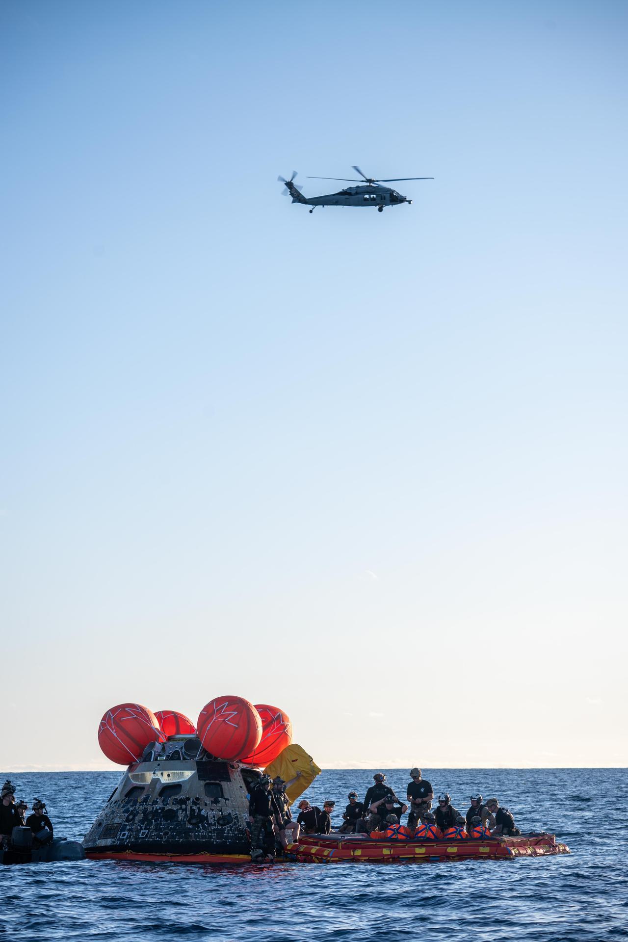 From left to right, Artemis II Commander Reid Wiseman, Mission Specialist Jeremy Hansen from the CSA (Canadian Space Agency), Pilot Victor Glover, and Mission Specialist Christina Koch from NASA, are extracted from NASA’s Orion spacecraft and loaded onto an inflatable raft, called the front porch, following splashdown in the Pacific Ocean near San Diego, California, at 5:07 p.m. PDT, (8:07 p.m. EDT) on Friday, April 10, 2026. The Artemis II crew will be taken to USS John P. Murtha to be routinely examined while NASA’s Landing and Recovery team and the U.S. Navy recover Orion and secure it in the well deck of USS John P. Murtha. The Artemis II test flight launched on Wednesday, April 1, from NASA’s Kennedy Space Center in Florida to begin its 10-day journey around the Moon for scientific discovery, economic benefits, and to build on our foundation for the first crewed missions to Mars.