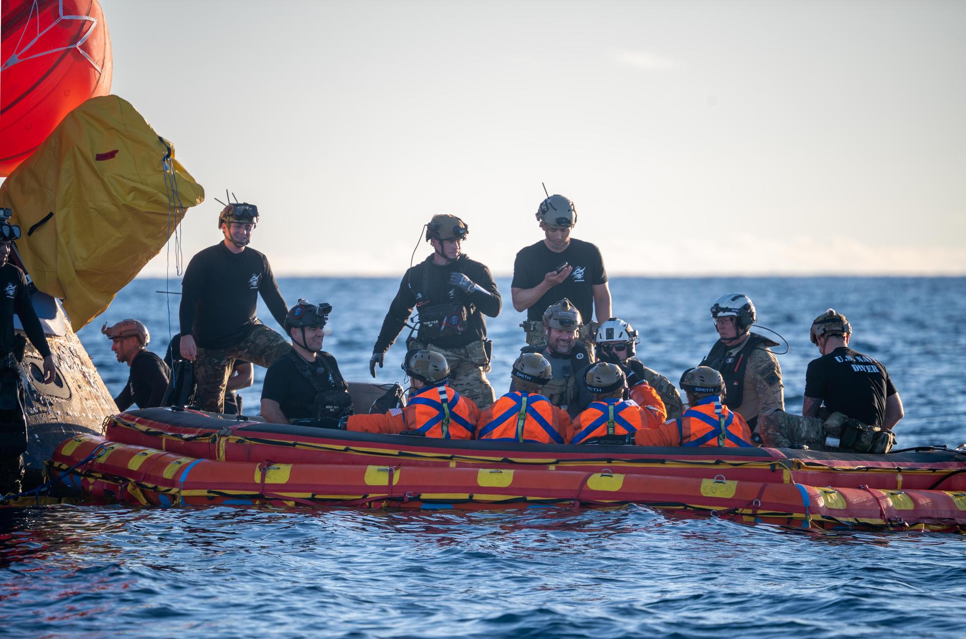 From left to right, Artemis II Commander Reid Wiseman, Mission Specialist Jeremy Hansen from the CSA (Canadian Space Agency), Pilot Victor Glover, and Mission Specialist Christina Koch from NASA, are extracted from NASA’s Orion spacecraft and loaded onto an inflatable raft, called the front porch, following splashdown in the Pacific Ocean near San Diego, California, at 5:07 p.m. PDT, (8:07 p.m. EDT) on Friday, April 10, 2026. The Artemis II crew will be taken to USS John P. Murtha to be routinely examined while NASA’s Landing and Recovery team and the U.S. Navy recover Orion and secure it in the well deck of USS John P. Murtha. The Artemis II test flight launched on Wednesday, April 1, from NASA’s Kennedy Space Center in Florida to begin its 10-day journey around the Moon for scientific discovery, economic benefits, and to build on our foundation for the first crewed missions to Mars.