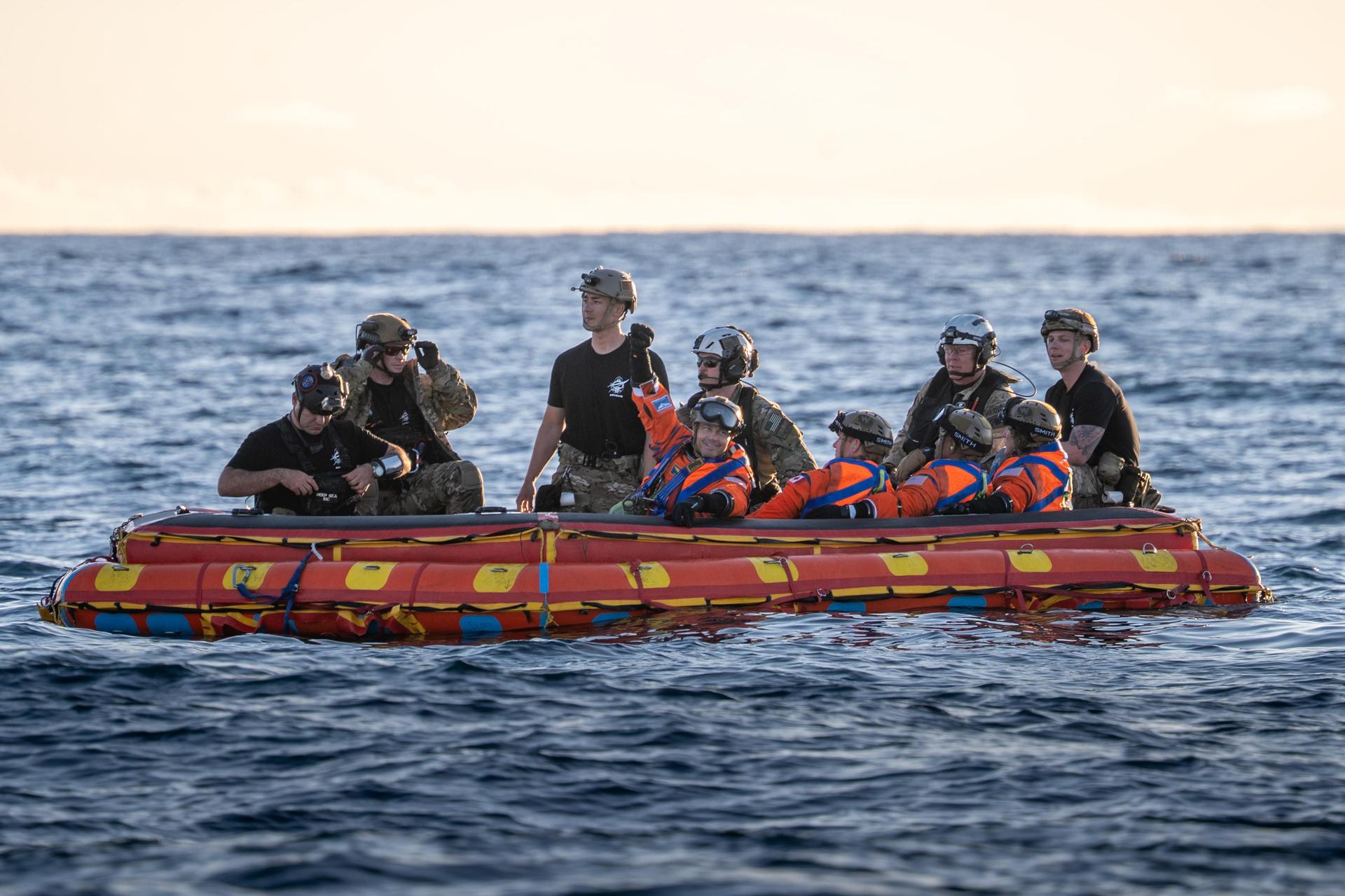 From left to right, Artemis II Commander Reid Wiseman, Mission Specialist Jeremy Hansen from the CSA (Canadian Space Agency), Pilot Victor Glover, and Mission Specialist Christina Koch from NASA, are extracted from NASA’s Orion spacecraft and loaded onto an inflatable raft, called the front porch, following splashdown in the Pacific Ocean near San Diego, California, at 5:07 p.m. PDT, (8:07 p.m. EDT) on Friday, April 10, 2026. The Artemis II crew will be taken to USS John P. Murtha to be routinely examined while NASA’s Landing and Recovery team and the U.S. Navy recover Orion and secure it in the well deck of USS John P. Murtha. The Artemis II test flight launched on Wednesday, April 1, from NASA’s Kennedy Space Center in Florida to begin its 10-day journey around the Moon for scientific discovery, economic benefits, and to build on our foundation for the first crewed missions to Mars.