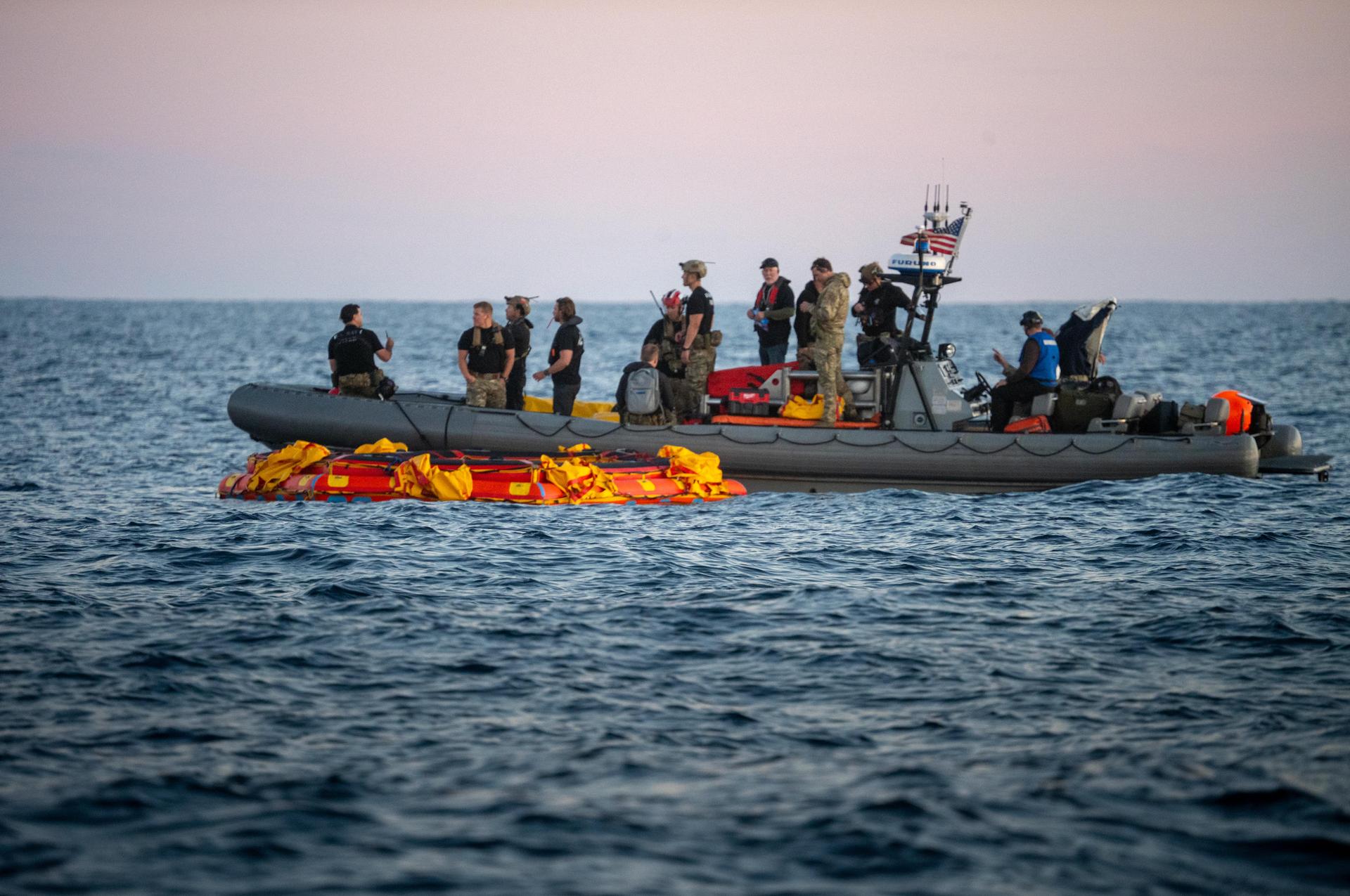 U.S. Navy personnel aboard an inflatable raft help recover NASA's Orion spacecraft following its splashdown in the Pacific Ocean near San Diego, California, at 5:07 p.m. PDT, (8:07 p.m. EDT) on Friday, April 10, 2026, after the Artemis II test flight. The Artemis II mission carrying Artemis II Commander Reid Wiseman, Pilot Victor Glover, and Mission Specialist Christina Koch from NASA, along with Mission Specialist Jeremy Hansen from the CSA (Canadian Space Agency), launched on Wednesday, April 1, from NASA’s Kennedy Space Center in Florida to begin its 10-day journey around the Moon for scientific discovery, economic benefits, and to build on our foundation for the first crewed missions to Mars. NASA’s Landing and Recovery team and the U.S. Navy are coordinating efforts to secure Orion in the well deck of USS John P. Murtha.