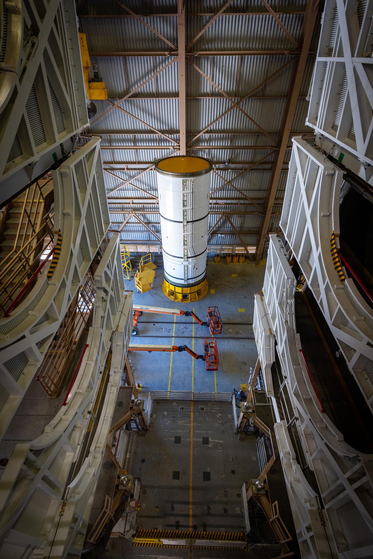 The left-hand forward solid rocket booster segment for NASA’s Artemis III SLS (Space Launch System) rocket is removed from its shipping container ahead of processing inside the Rotation, Processing and Surge Facility at the agency’s Kennedy Space Center in Florida on Wednesday, April 15, 2026. The SLS rocket’s twin boosters, manufactured by Northrop Grumman in Utah, will provide more than 75 percent of the SLS rocket’s total thrust at launch. The Artemis III mission will launch crew in the Orion spacecraft on top of the SLS rocket to test rendezvous and docking capabilities between Orion and commercial spacecraft needed to land astronauts on the Moon. 