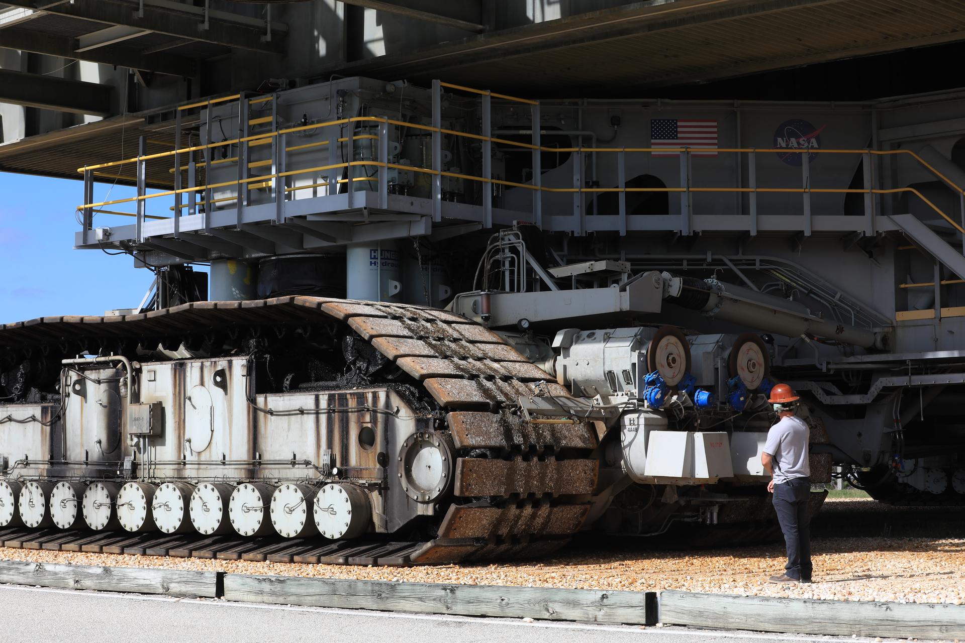 Technicians with NASA’s Exploration Gound Systems Program monitor crawler-transporter 2 as it transports the agency’s mobile launcher 1 slowly from Launch Complex 39B to the Vehicle Assembly Building at NASA’s Kennedy Space Center in Florida on Thursday, April 16, 2026, in preparation for Artemis III stacking operations. Teams will perform checkouts, inspections, and data analysis, and make repairs to the tower that saw damage during liftoff of the Artemis II test flight.  