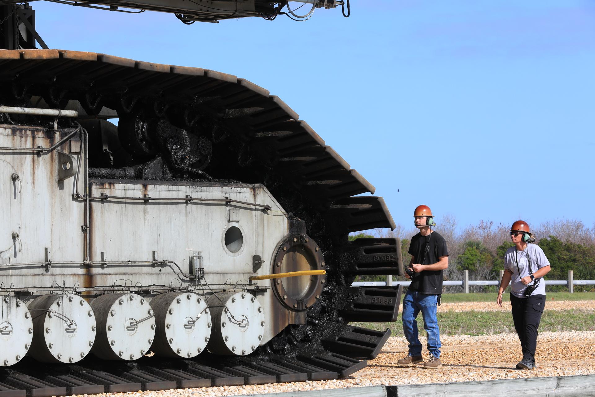 Technicians with NASA’s Exploration Gound Systems Program monitor crawler-transporter 2 as it transports the agency’s mobile launcher 1 slowly from Launch Complex 39B to the Vehicle Assembly Building at NASA’s Kennedy Space Center in Florida on Thursday, April 16, 2026, in preparation for Artemis III stacking operations. Teams will perform checkouts, inspections, and data analysis, and make repairs to the tower that saw damage during liftoff of the Artemis II test flight.  