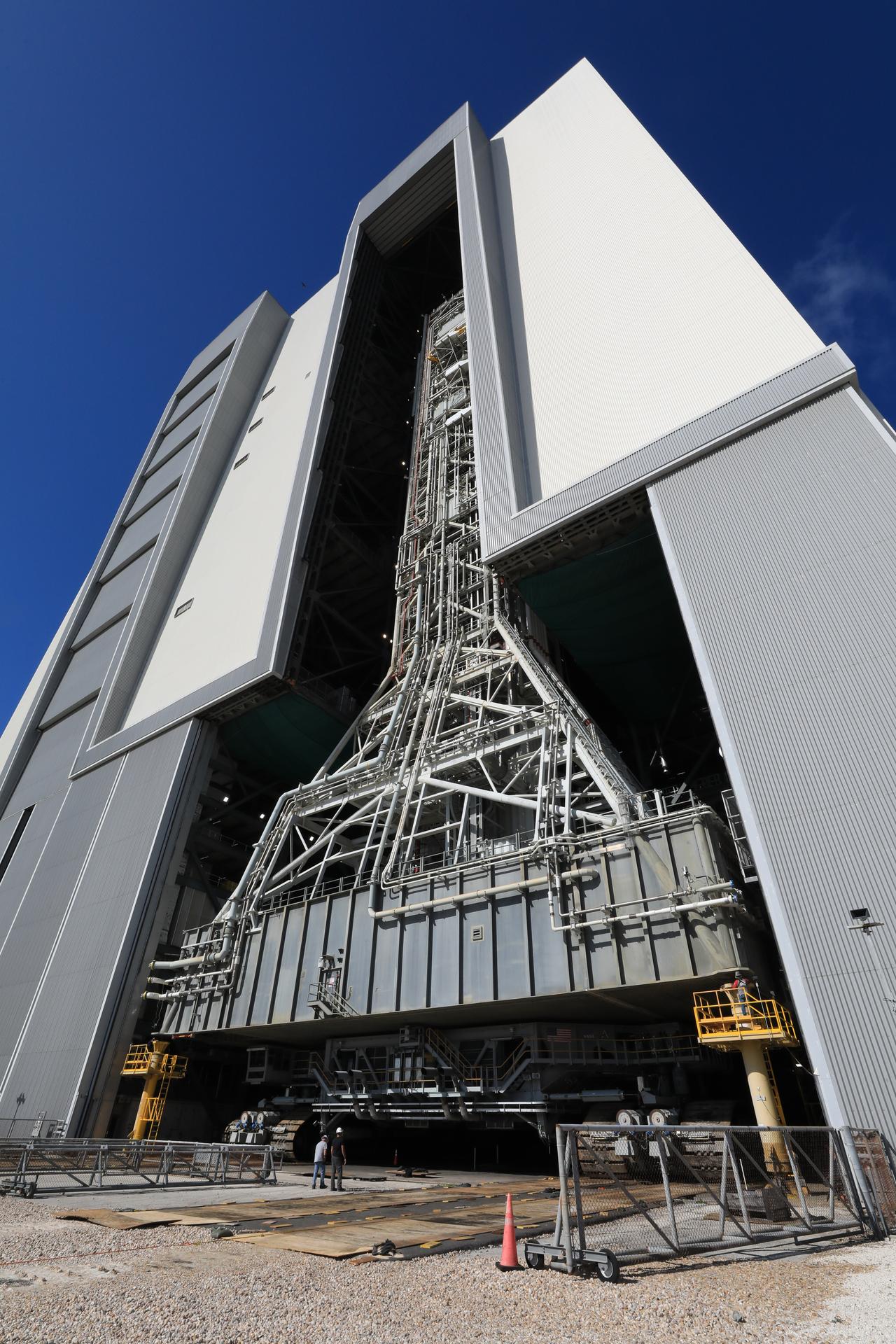 NASA’s mobile launcher enters the Vehicle Assembly Building following its approximately 4-mile trek from Launch Complex 39B at the agency’s Kennedy Space Center in Florida on Friday, April 17, 2026, in preparation for Artemis III stacking operations. Teams will perform checkouts, inspections, and data analysis, and make repairs to the tower that saw damage during launch of NASA’s Artemis II test flight on April 1, 2026.  