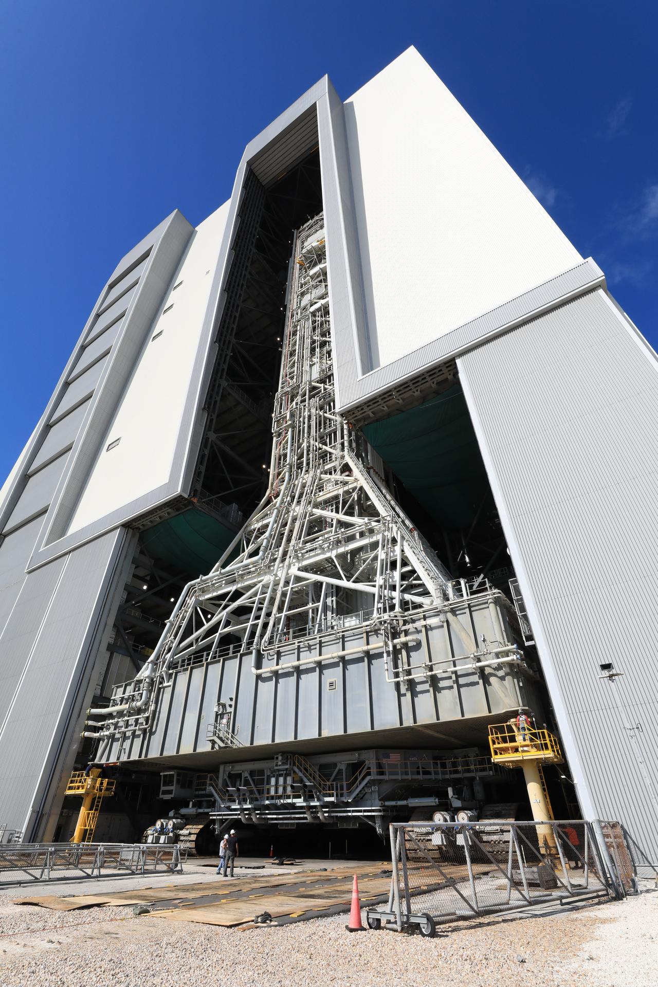 NASA’s mobile launcher enters the Vehicle Assembly Building following its approximately 4-mile trek from Launch Complex 39B at the agency’s Kennedy Space Center in Florida on Friday, April 17, 2026, in preparation for Artemis III stacking operations. Teams will perform checkouts, inspections, and data analysis, and make repairs to the tower that saw damage during launch of NASA’s Artemis II test flight on April 1, 2026.  