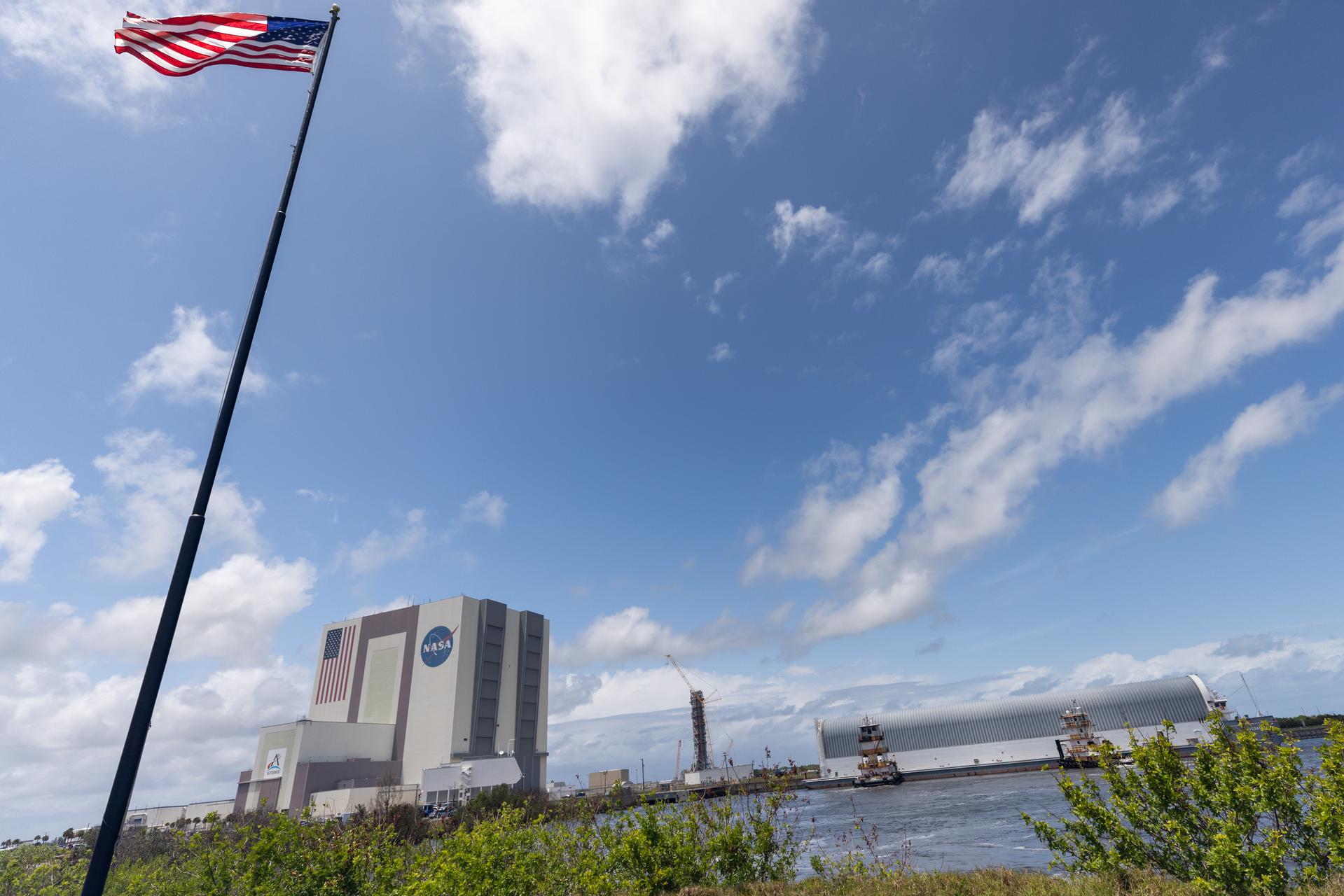 NASA’s Pegasus barge, carrying the top four-fifths of the agency’s SLS (Space Launch System) core stage for the Artemis III mission, arrives at NASA’s Kennedy Space Center Complex 39 turn basin wharf in Florida on Monday, April 27, 2026. Artemis III will launch astronauts to Earth’s orbit aboard the Orion spacecraft on top of SLS to test rendezvous and docking capabilities between Orion and commercial spacecraft needed to land Artemis IV astronauts on the Moon in 2028. 