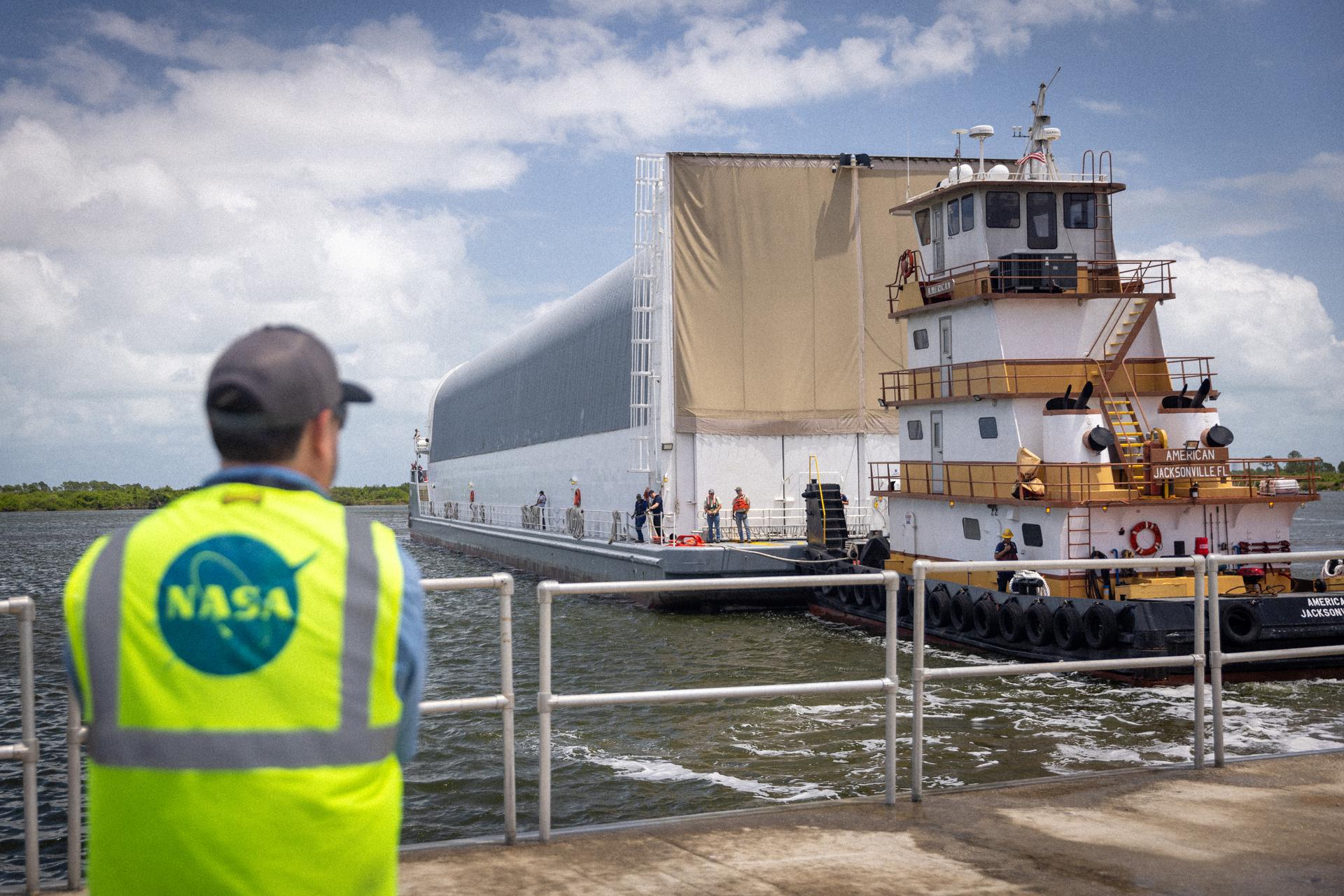 NASA’s Pegasus barge, carrying the top four-fifths of the agency’s SLS (Space Launch System) core stage for the Artemis III mission, arrives at NASA’s Kennedy Space Center Complex 39 turn basin wharf in Florida on Monday, April 27, 2026. Artemis III will launch astronauts to Earth’s orbit aboard the Orion spacecraft on top of SLS to test rendezvous and docking capabilities between Orion and commercial spacecraft needed to land Artemis IV astronauts on the Moon in 2028. 
