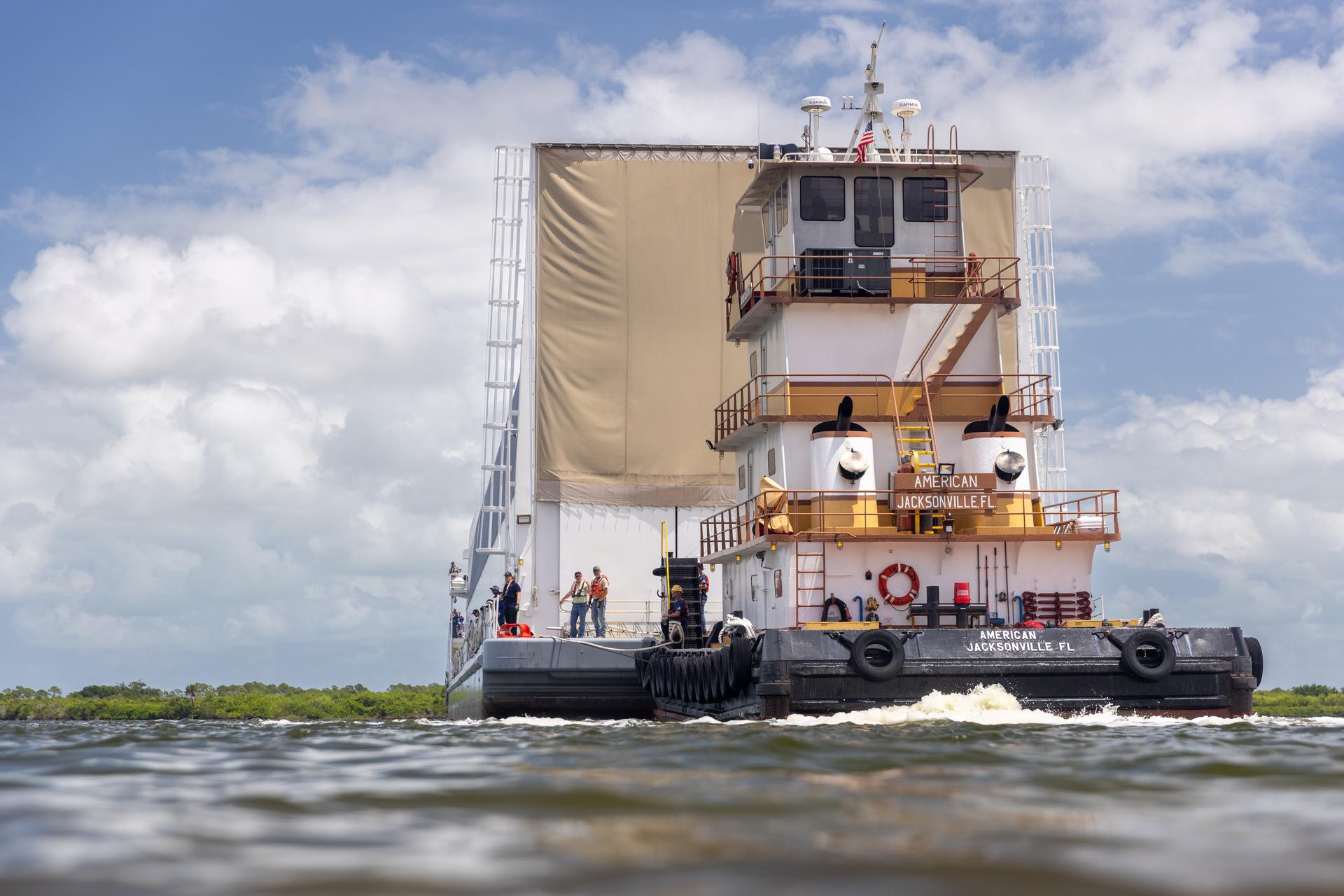 NASA’s Pegasus barge, carrying the top four-fifths of the agency’s SLS (Space Launch System) core stage for the Artemis III mission, arrives at NASA’s Kennedy Space Center Complex 39 turn basin wharf in Florida on Monday, April 27, 2026. Artemis III will launch astronauts to Earth’s orbit aboard the Orion spacecraft on top of SLS to test rendezvous and docking capabilities between Orion and commercial spacecraft needed to land Artemis IV astronauts on the Moon in 2028. 
