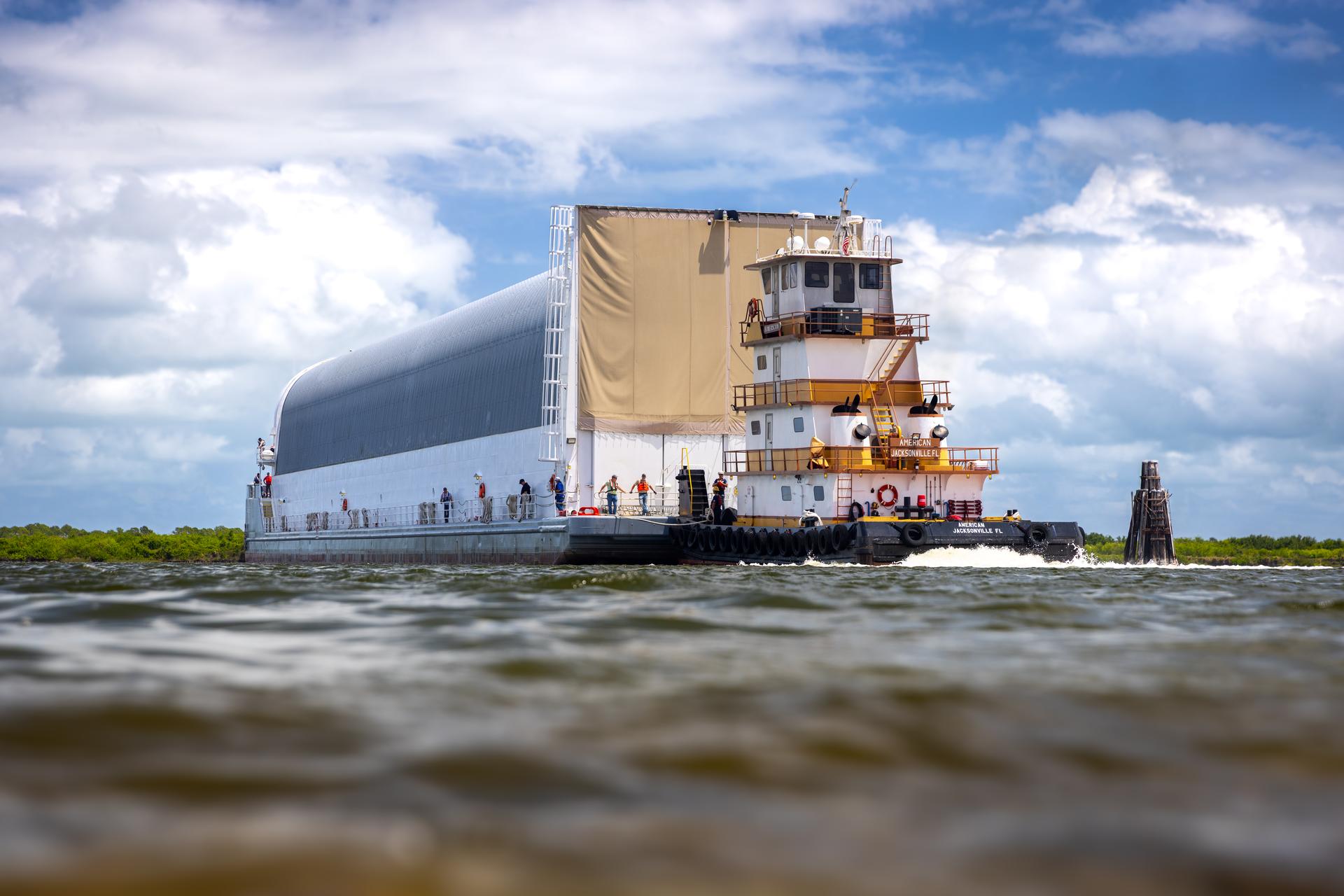 NASA’s Pegasus barge, carrying the top four-fifths of the agency’s SLS (Space Launch System) core stage for the Artemis III mission, arrives at NASA’s Kennedy Space Center Complex 39 turn basin wharf in Florida on Monday, April 27, 2026. Artemis III will launch astronauts to Earth’s orbit aboard the Orion spacecraft on top of SLS to test rendezvous and docking capabilities between Orion and commercial spacecraft needed to land Artemis IV astronauts on the Moon in 2028. 
