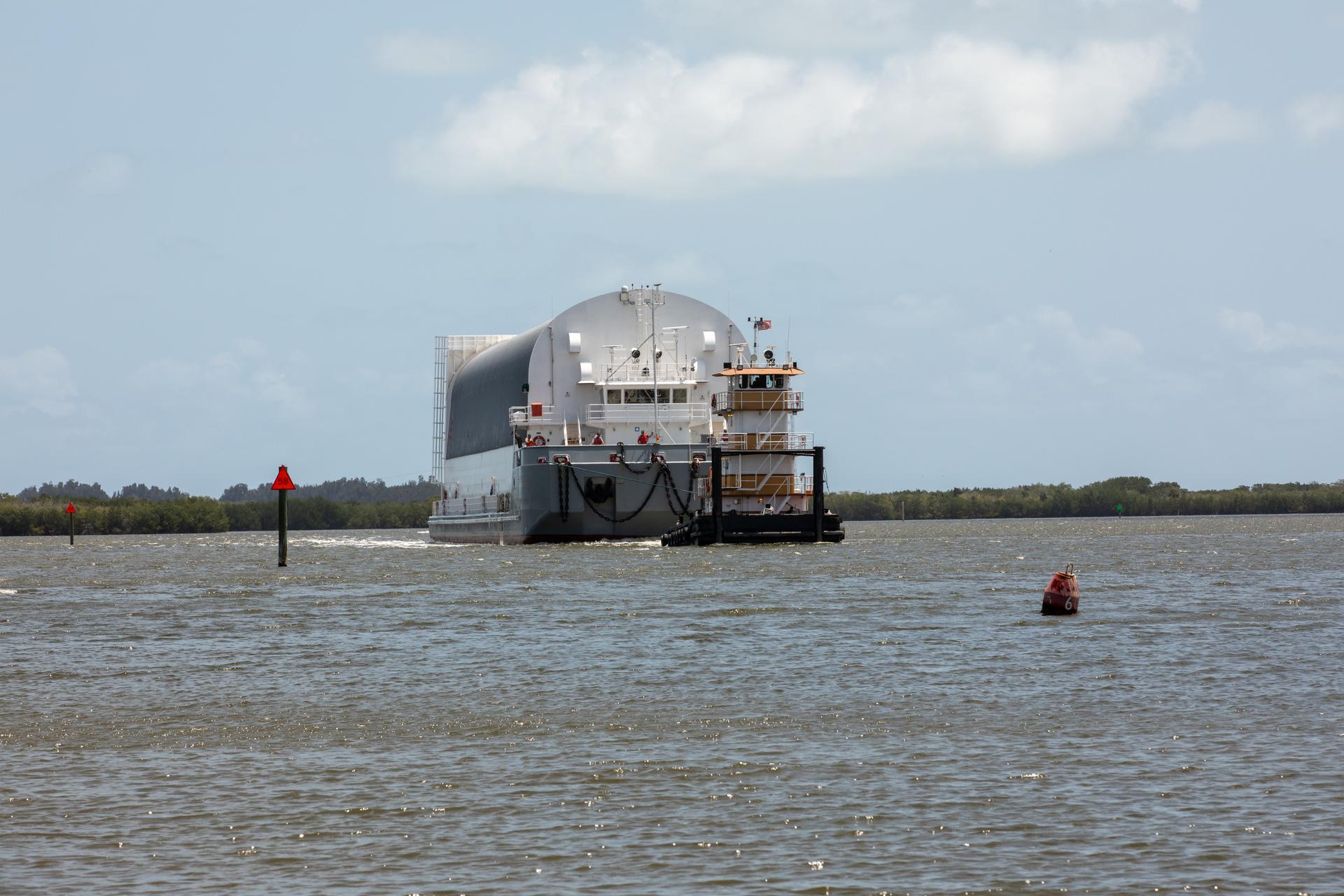NASA’s Pegasus barge, carrying the top four-fifths of the agency’s SLS (Space Launch System) core stage for the Artemis III mission, arrives at NASA’s Kennedy Space Center Complex 39 turn basin wharf in Florida on Monday, April 27, 2026. Artemis III will launch astronauts to Earth’s orbit aboard the Orion spacecraft on top of SLS to test rendezvous and docking capabilities between Orion and commercial spacecraft needed to land Artemis IV astronauts on the Moon in 2028. 