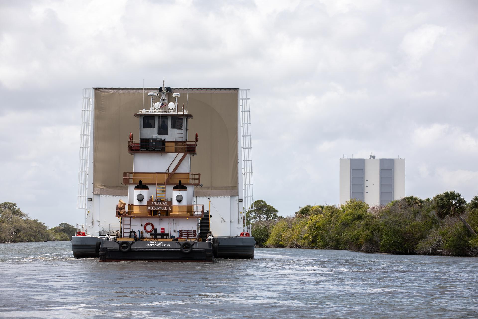 NASA’s Pegasus barge, carrying the top four-fifths of the agency’s SLS (Space Launch System) core stage for the Artemis III mission, arrives at NASA’s Kennedy Space Center Complex 39 turn basin wharf in Florida on Monday, April 27, 2026. Artemis III will launch astronauts to Earth’s orbit aboard the Orion spacecraft on top of SLS to test rendezvous and docking capabilities between Orion and commercial spacecraft needed to land Artemis IV astronauts on the Moon in 2028. 