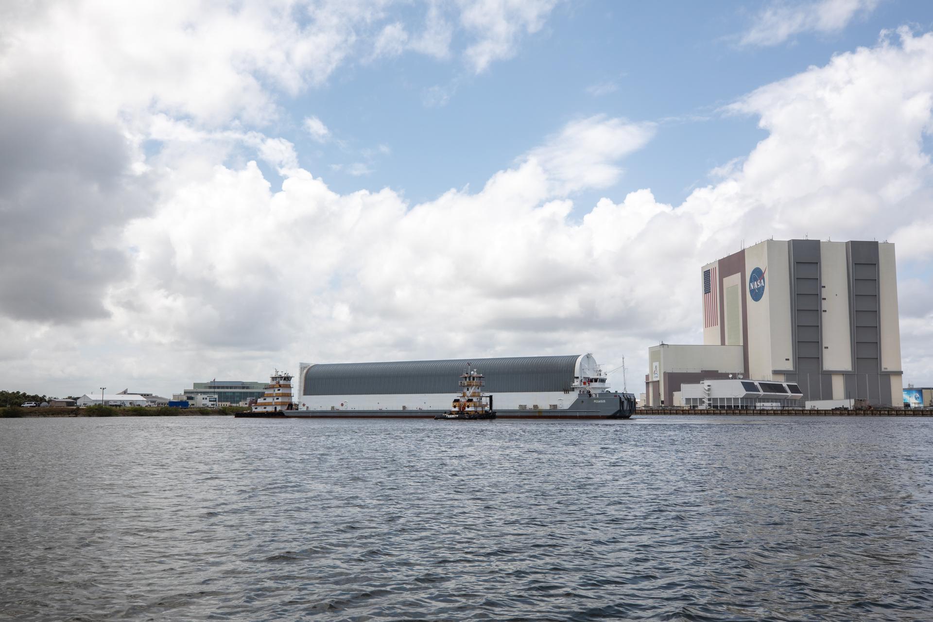 NASA’s Pegasus barge, carrying the top four-fifths of the agency’s SLS (Space Launch System) core stage for the Artemis III mission, arrives at NASA’s Kennedy Space Center Complex 39 turn basin wharf in Florida on Monday, April 27, 2026. Artemis III will launch astronauts to Earth’s orbit aboard the Orion spacecraft on top of SLS to test rendezvous and docking capabilities between Orion and commercial spacecraft needed to land Artemis IV astronauts on the Moon in 2028. 
