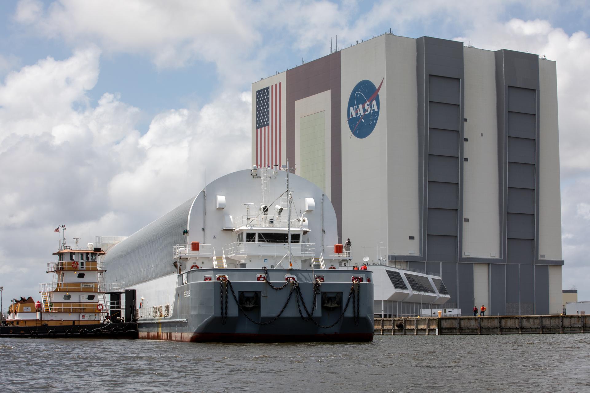 NASA’s Pegasus barge, carrying the top four-fifths of the agency’s SLS (Space Launch System) core stage for the Artemis III mission, arrives at NASA’s Kennedy Space Center Complex 39 turn basin wharf in Florida on Monday, April 27, 2026. Artemis III will launch astronauts to Earth’s orbit aboard the Orion spacecraft on top of SLS to test rendezvous and docking capabilities between Orion and commercial spacecraft needed to land Artemis IV astronauts on the Moon in 2028. 