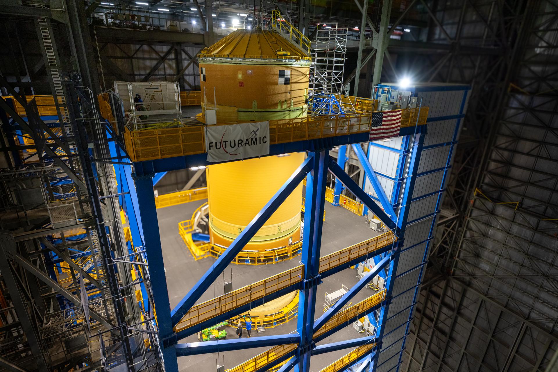 Technicians at NASA’s Kennedy Space Center in Florida complete operations of lifting and lowering the agency’s Artemis III SLS (Space Launch System) core stage into High Bay 2 in the Vehicle Assembly Building at NASA Kennedy on Monday, May 4, 2026. Using a one-of-a kind lifting beam designed to lift the core stage from the transfer aisle to High Bay 2 for additional assembly, teams will connect the core stage to the engine section. This marks the first time core stage assembly operations being conducted at the spaceport for future Artemis missions.    