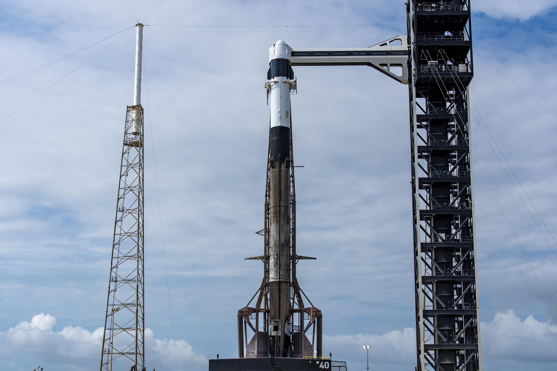 A SpaceX Falcon 9 rocket, with the company’s Dragon spacecraft atop, stands in a vertical position at Space Launch Complex 40 at Cape Canaveral Space Force Station in Florida on Wednesday, May 13, 2026, in preparation for the company’s 34th commercial resupply services launch to the International Space Station for NASA. Dragon will deliver about 6,500 pounds of science investigations, supplies, and equipment to the International Space Station. NASA and SpaceX are targeting liftoff at 6:50 p.m. EDT, Wednesday May 13.