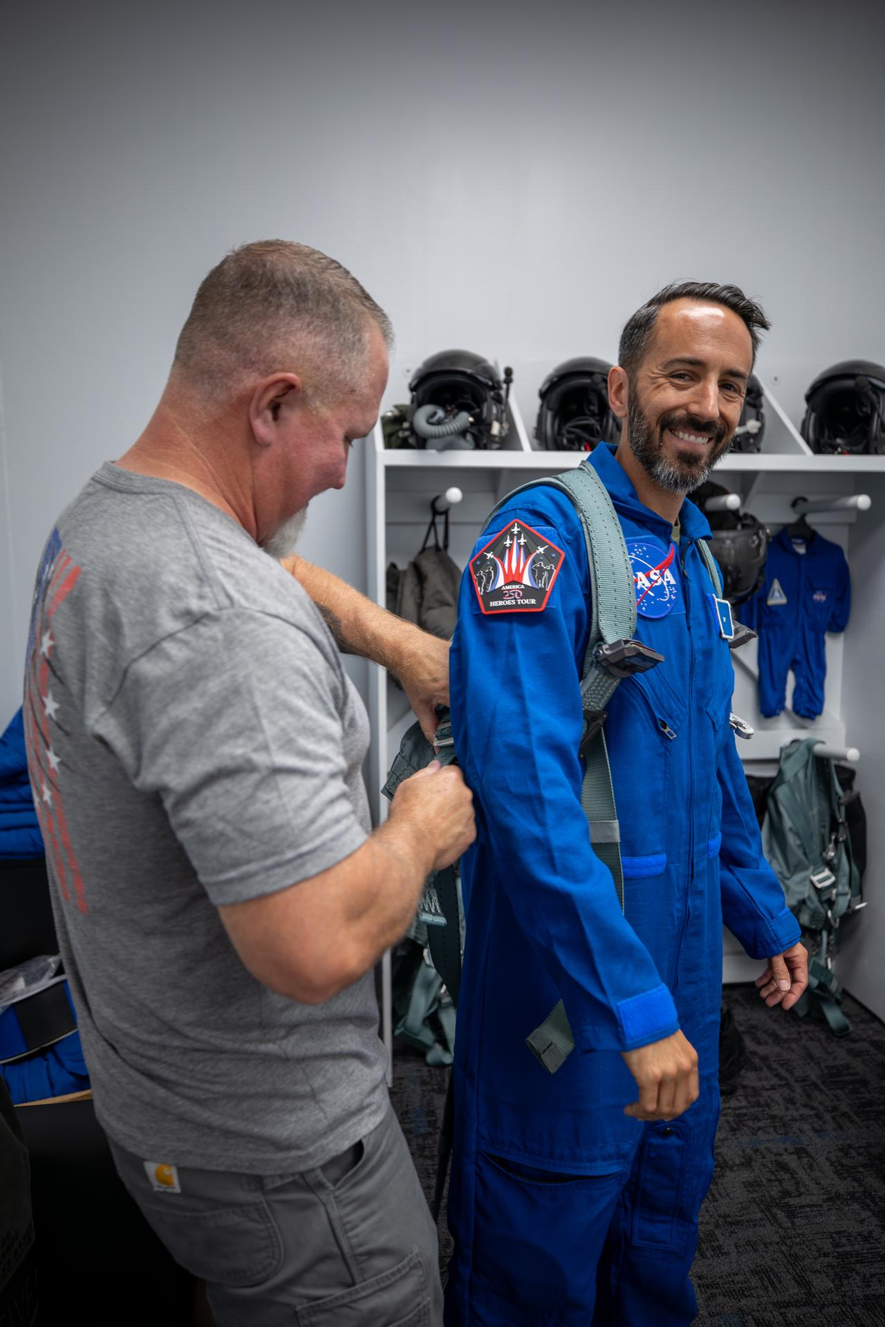 NASA employee Matthew Kufner, right, dons his flight suit ahead of a ride-along flight aboard one of NASA Administrator Jared Isaacman’s personal F-5 aircraft on Wednesday, June 17, 2026, at the Launch and Landing Facility at the agency’s Kennedy Space Center in Florida. As part of the Administrator’s Flight Experience Award program, Kufner and other awardees suited up, completed preflight briefings, and experienced a unique flight. The ride-along flight experience award program highlights NASA’s commitment to celebrating excellence across the workforce.