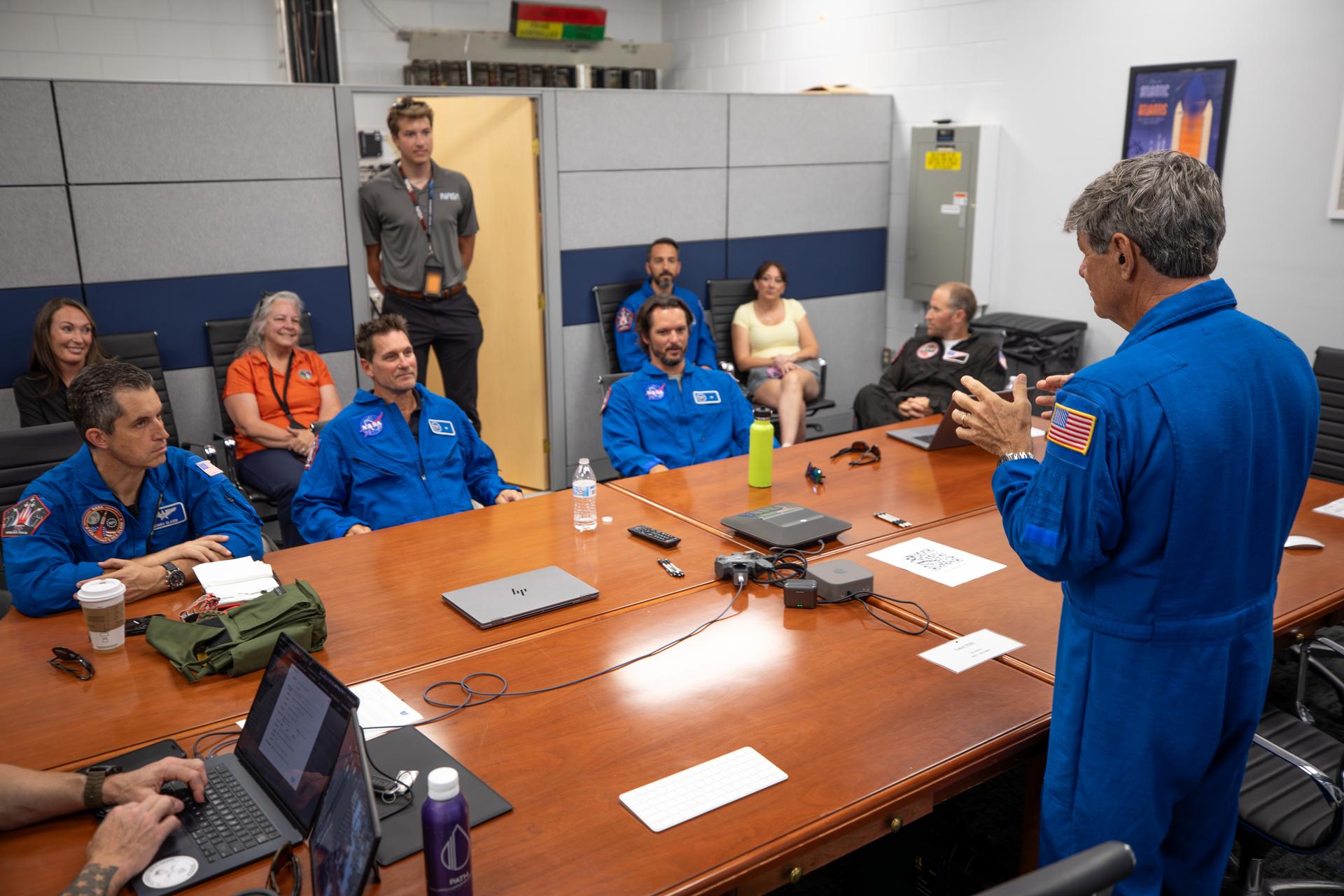 As part of NASA Administrator Jared Isaacman’s Flight Experience Award program, NASA employees Matthew Kufner, Charles Meilbye, Aaron Smith participate in a preflight briefing on Wednesday, June 17, 2026, at the Launch and Landing Facility at the agency’s Kennedy Space Center in Florida. The awardees donned NASA flight suits, completed preflight briefings, and experienced a unique flight aboard the administrator’s personal F-5 aircraft. The ride-along flight experience award program highlights NASA’s commitment to celebrating excellence across the workforce.