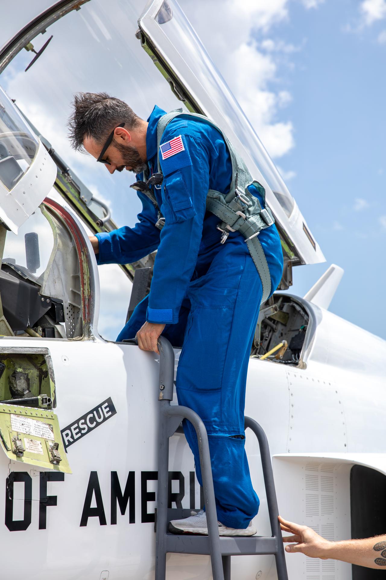 NASA employee Matthew Kufner climbs into one of NASA Administrator Jared Isaacman’s personal F-5 aircraft, as part of the Administrator’s Flight Experience Award program on Wednesday, June 17, 2026, at the Launch and Landing Facility at the agency’s Kennedy Space Center in Florida. Multiple NASA awardees donned NASA flight suits, completed preflight briefings, and experienced a unique flight aboard the administrator’s personal F-5 aircraft. The ride-along flight experience award program highlights NASA’s commitment to celebrating excellence across the workforce.