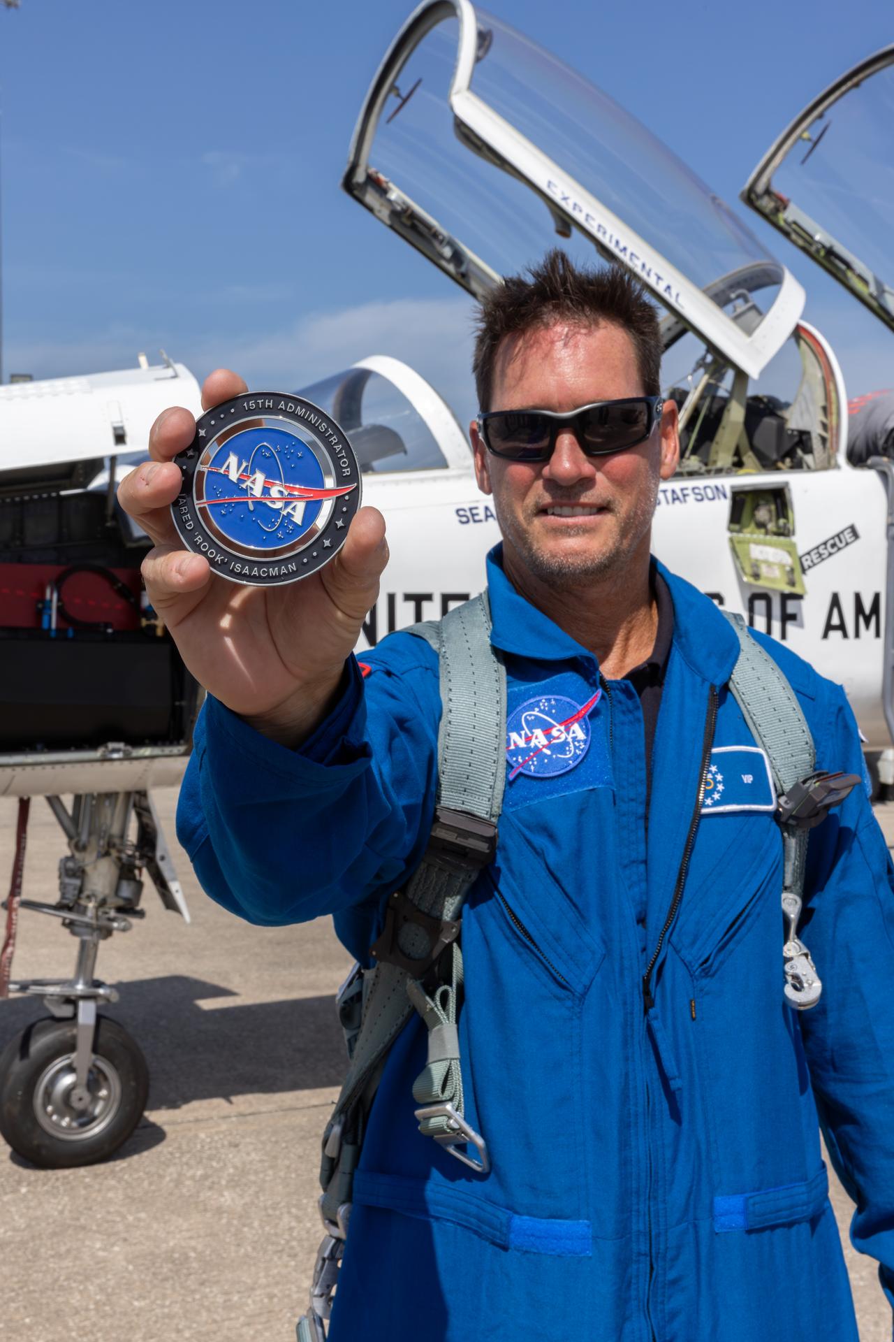 NASA employee Charles Meilbye is recognized as part of NASA Administrator Jared Isaacman’s Flight Experience Award program on Wednesday, June 17, 2026, at the Launch and Landing Facility at the agency’s Kennedy Space Center in Florida. Meilbye, with other awardees, suited up, completed preflight briefings, and experienced a unique flight aboard the administrator’s personal F-5 aircraft. The ride-along flight experience award program highlights NASA’s commitment to celebrating excellence across the workforce.