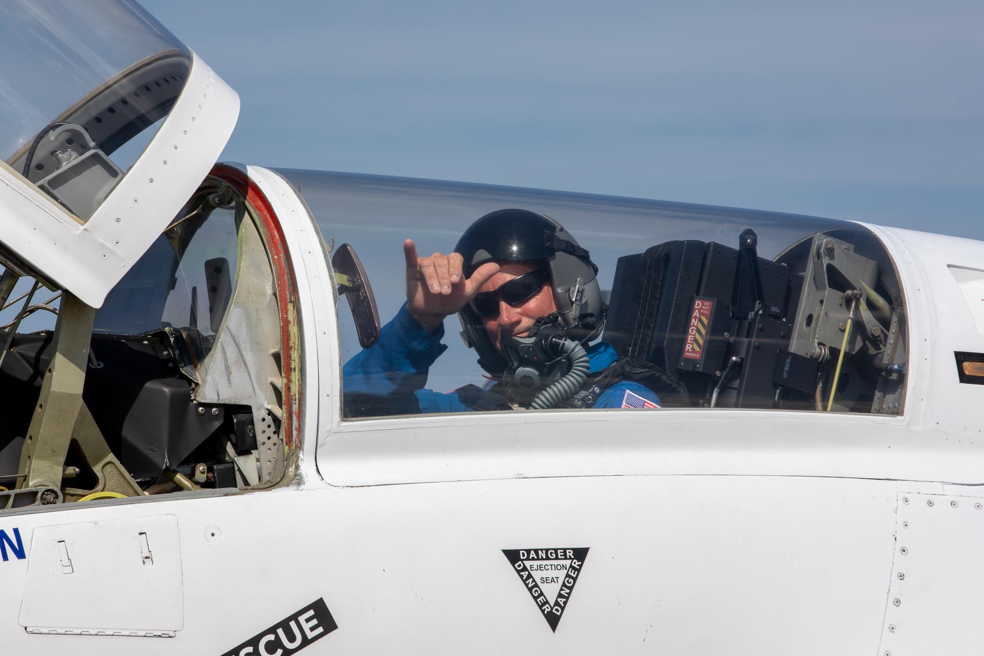 NASA employee Charles Meilbye gestures from inside the canopy of one of NASA Administrator Jared Isaacman’s personal F-5 aircraft as it prepares to take off from the Launch and Landing Facility at the agency’s Kennedy Space Center in Florida on Wednesday, June 17, 2026. As part of the administrator’s Flight Experience Award program, Meilbye and other NASA awardees donned NASA flight suits, completed preflight briefings, and experienced a unique flight. The ride-along flight experience award program highlights NASA’s commitment to celebrating excellence across the workforce.