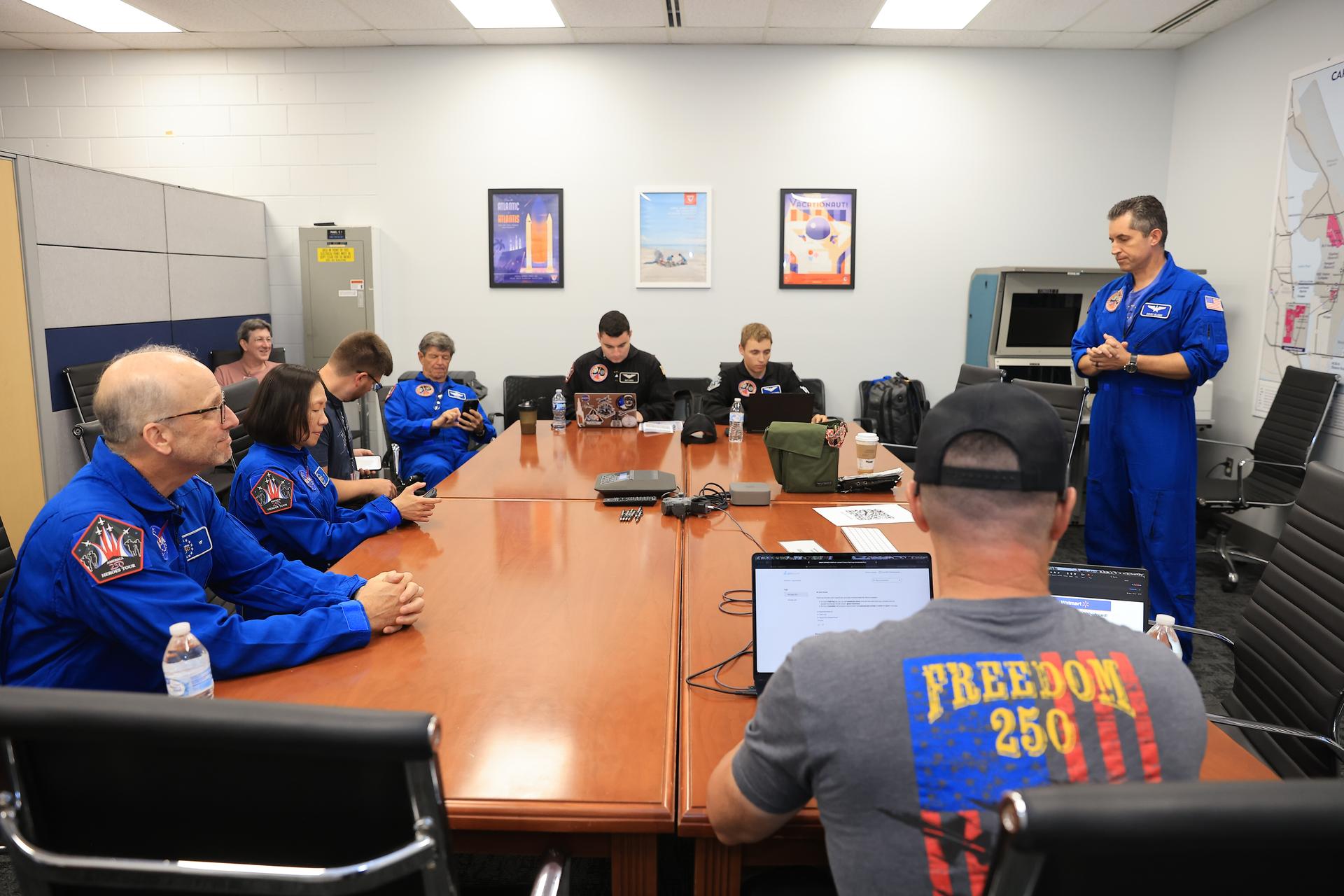 As part of NASA Administrator Jared Isaacman’s Flight Experience Award program, NASA employees Kuo-Chia “Alice” Liu, Raymond “Jim” Lanzi, and Logan Larson participate in a pre-flight briefing on Thursday, June 18, 2026, at the Launch and Landing Facility at the agency’s Kennedy Space Center in Florida. Awardees donned NASA flight suits, completed pre-flight briefings, and experienced a unique flight aboard the administrator’s personal F-5 aircraft. The ride-along flight experience award program highlights NASA’s commitment to celebrating excellence across the workforce.