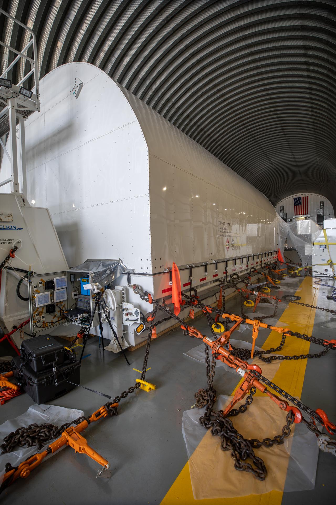 Housed inside a protective and environmentally controlled transportation container, NASA’s Nancy Grace Roman Space Telescope is secured in the usable cargo deck of the agency’s Pegasus barge as it arrives at the Launch Complex 39 turn basin at NASA’s Kennedy Space Center in Florida on Sunday, June 21, 2026. Teams will offload and transport the observatory to the spaceport’s Payload Hazardous Servicing Facility where it will undergo processing ahead of launch, targeted no earlier than Sunday, Aug. 30, 2026. Named for NASA’s first chief astronomer and “mother of the Hubble Space Telescope,” Roman will offer a field of view over 100 times larger than Hubble’s to study up to a billion galaxies, directly image exoplanets and planet forming disks, and address fundamental questions about dark energy, exoplanets, and infrared astrophysics.