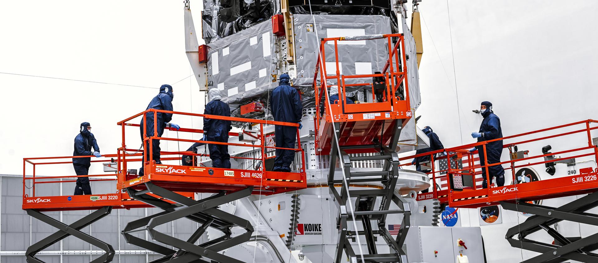 Technicians and engineers inside the Payload Hazardous Servicing Facility at NASA’s Kennedy Space Center in Florida use a crane to lift the agency’s Nancy Grace Roman Space Telescope to a specialized work stand Friday, June 26, 2026. Named for NASA’s first chief astronomer and “mother of the Hubble Space Telescope,” the Roman Space Telescope will offer a field of view at least 100 times larger than Hubble’s, resulting in deep, sweeping explorations of the cosmos.