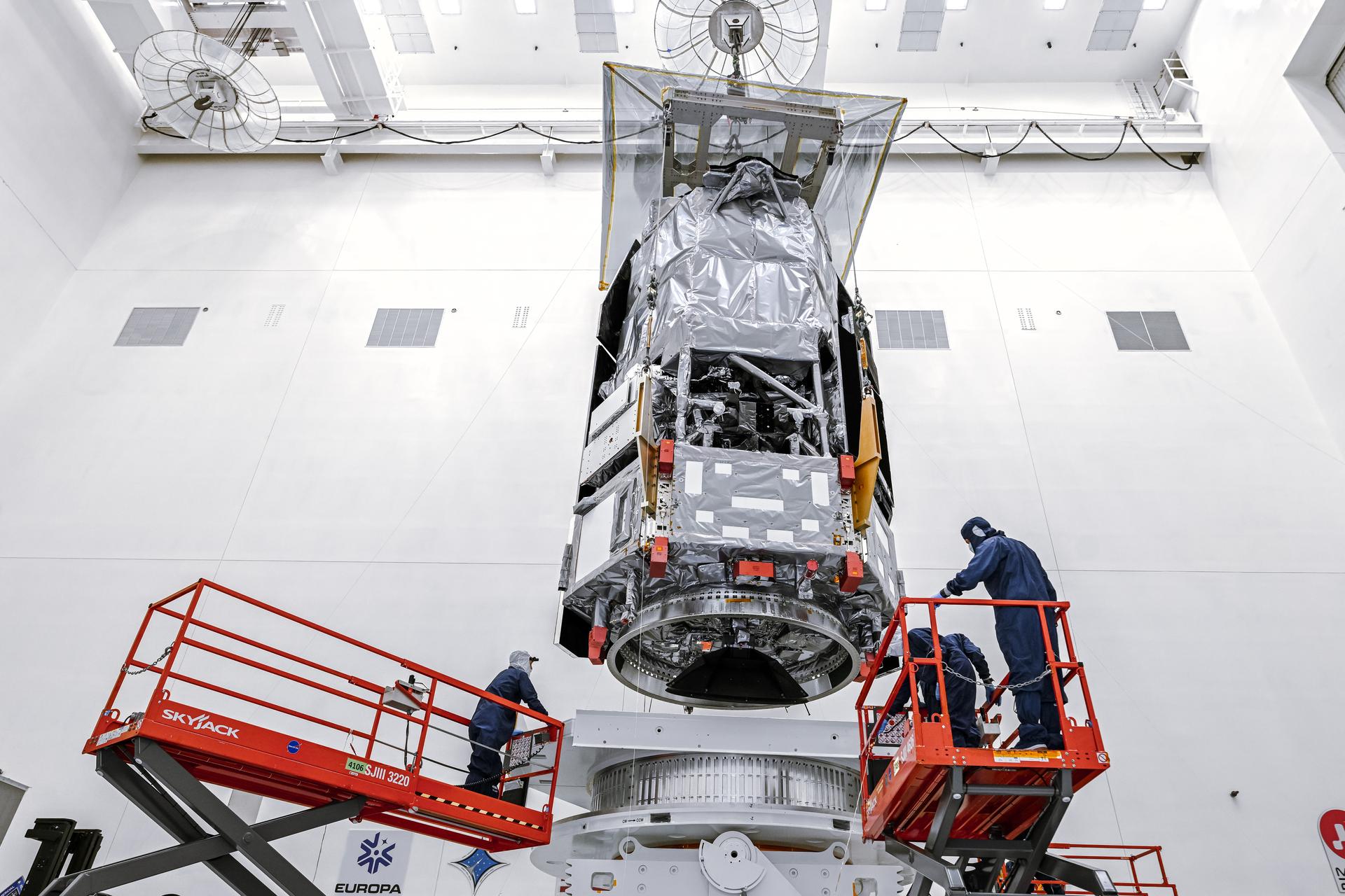 Technicians and engineers inside the Payload Hazardous Servicing Facility at NASA’s Kennedy Space Center in Florida use a crane to lift the agency’s Nancy Grace Roman Space Telescope to a specialized work stand Friday, June 26, 2026. Named for NASA’s first chief astronomer and “mother of the Hubble Space Telescope,” the Roman Space Telescope will offer a field of view at least 100 times larger than Hubble’s, resulting in deep, sweeping explorations of the cosmos.