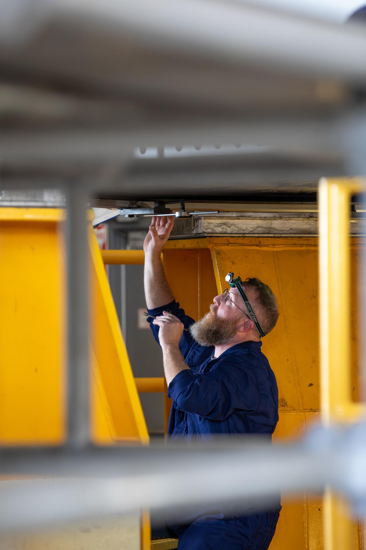 The left-hand forward solid rocket booster segment for NASA’s Artemis III SLS (Space Launch System) rocket is offloaded from its rail car transportation container and inspected ahead of processing inside the Rotation, Processing and Surge Facility at the agency’s Kennedy Space Center in Florida on Tuesday, June 30, 2026. The SLS rocket’s twin boosters, manufactured by Northrop Grumman in Utah, will provide more than 75 percent of the SLS rocket’s total thrust at launch. The Artemis III mission will launch crew in the Orion spacecraft on top of the SLS rocket to test rendezvous and docking capabilities between Orion and commercial spacecraft needed to land astronauts on the Moon.