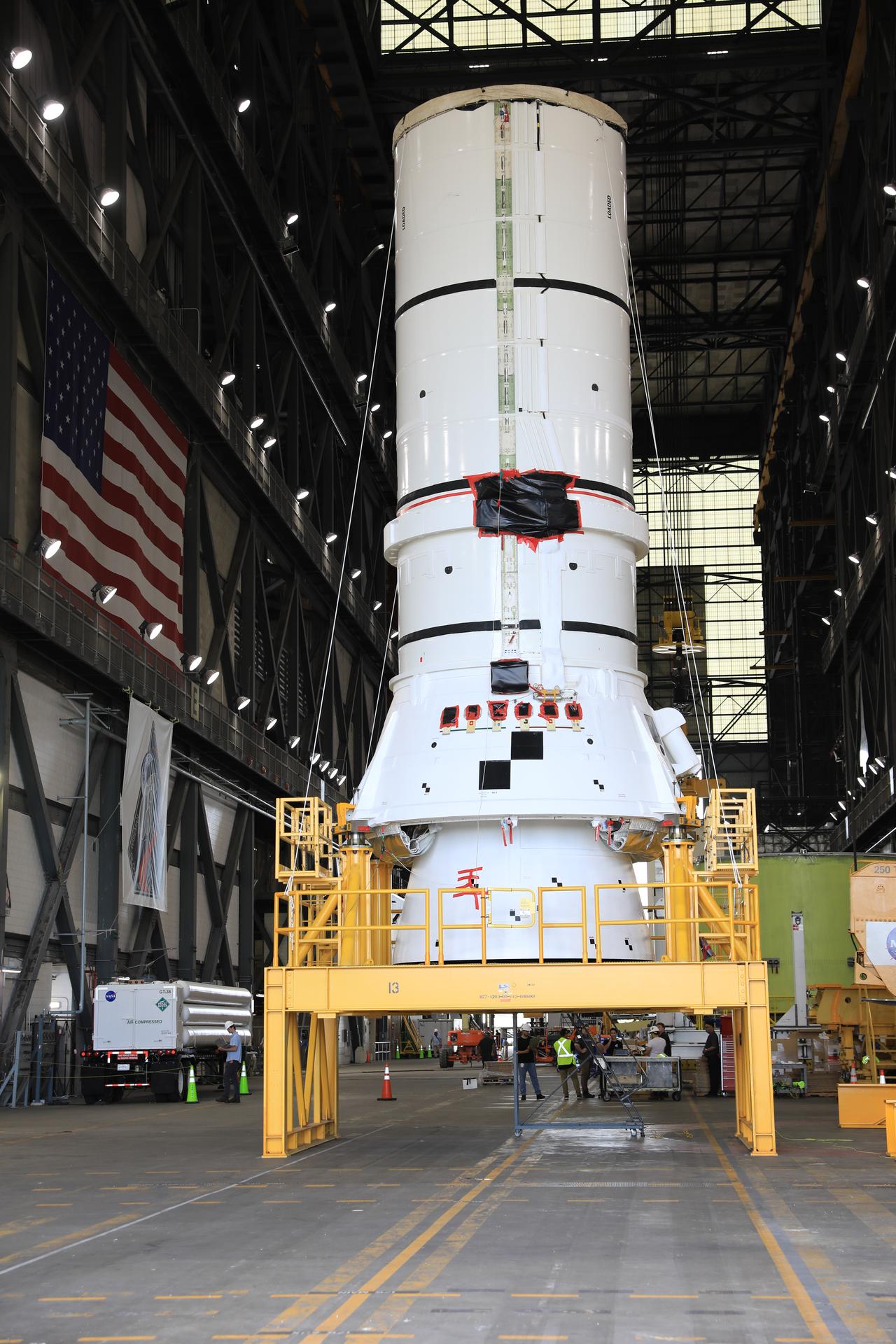 The left-hand aft assembly solid rocket booster segment for NASA’s Artemis III SLS (Space Launch System) rocket arrives at the agency’s Vehicle Assembly Building at NASA’s Kennedy Space Center in Florida on Monday, July 6, 2026, ahead of stacking on top of the mobile launcher for the Artemis III mission. The twin boosters, manufactured by Northrop Grumman in Utah, will provide more than 75 percent of the SLS rocket’s total thrust at launch. The Artemis III mission will launch crew in the Orion spacecraft on top of the SLS rocket to test rendezvous and docking capabilities between Orion and commercial spacecraft needed to land astronauts on the Moon.
