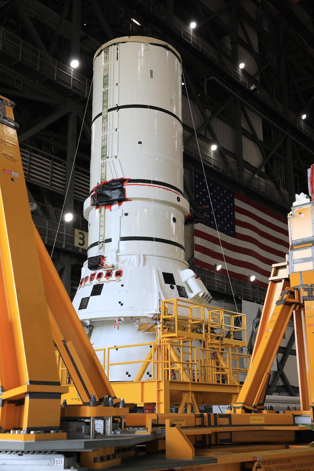 The left-hand aft assembly solid rocket booster segment for NASA’s Artemis III SLS (Space Launch System) rocket arrives at the agency’s Vehicle Assembly Building at NASA’s Kennedy Space Center in Florida on Monday, July 6, 2026, ahead of stacking on top of the mobile launcher for the Artemis III mission. The twin boosters, manufactured by Northrop Grumman in Utah, will provide more than 75 percent of the SLS rocket’s total thrust at launch. The Artemis III mission will launch crew in the Orion spacecraft on top of the SLS rocket to test rendezvous and docking capabilities between Orion and commercial spacecraft needed to land astronauts on the Moon.