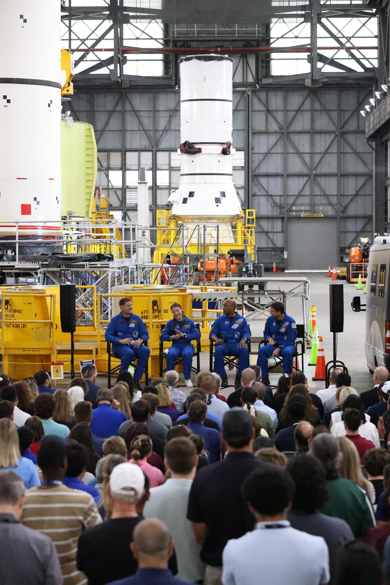From left, the Artemis II crew, CSA (Canadian Space Agency) astronaut Jeremy Hansen, and NASA astronauts Christina Koch, Victor Glover, and Reid Wiseman, speak to employees inside the Vehicle Assembly Building at NASA’s Kennedy Space Center in Florida on Tuesday, July 7, 2026. The crew returned to NASA Kennedy for their first official visit since launch of Artemis II on Wednesday, April 1, 2026, to visit with the center’s workforce and tour facilities to view progress on Artemis III prelaunch processing.