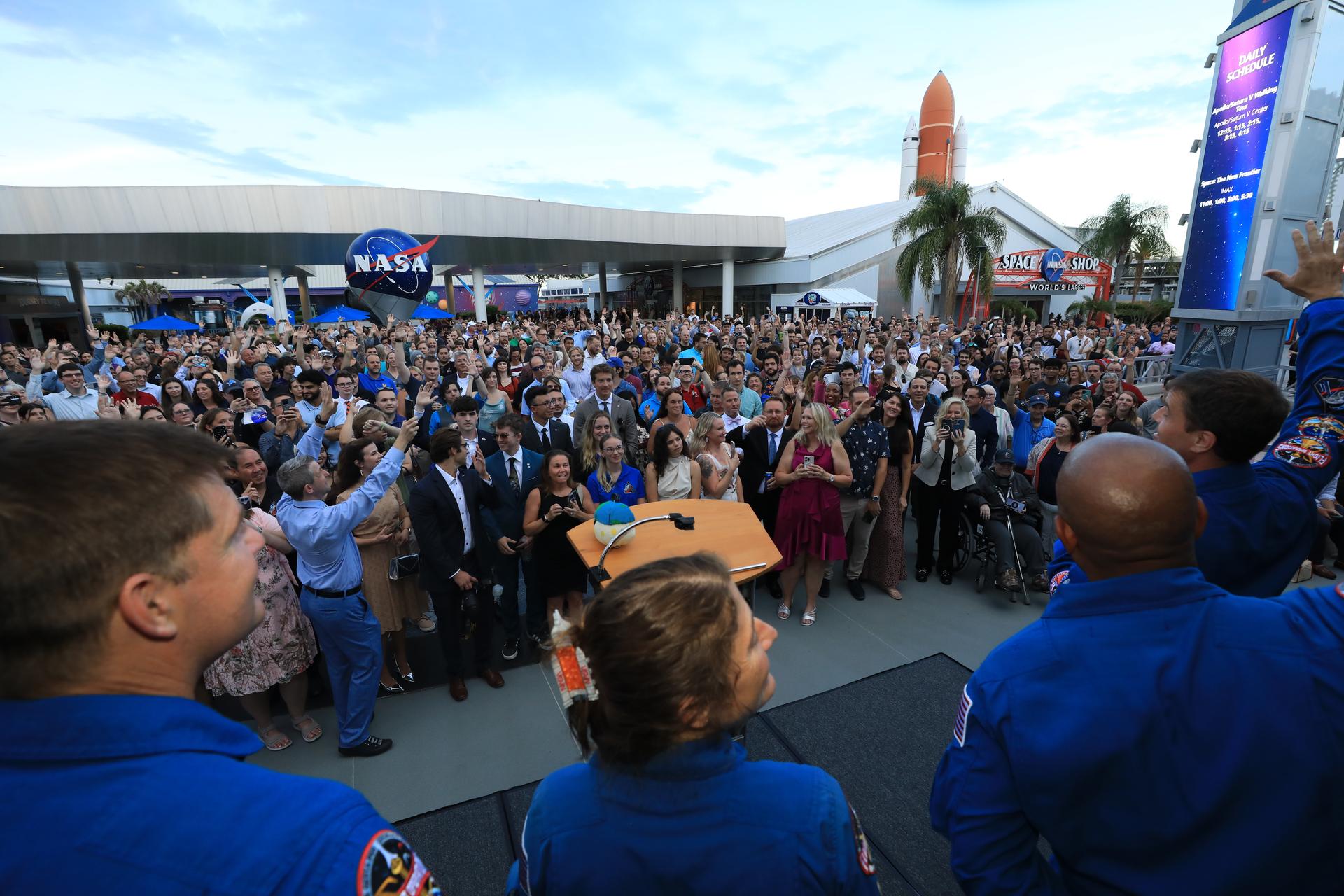 From left, Artemis II CSA (Canadian Space Agency) astronaut Jeremy Hansen, and NASA astronauts Christina Koch, Victor Glover, and Reid Wiseman speak to NASA employees at the Kennedy Space Center Visitor Complex in Florida on Tuesday, July 7, 2026. The crew returned to NASA Kennedy for their first official visit since launch of Artemis II on Wednesday, April 1, 2026, to visit with the center’s workforce and tour facilities to view progress on Artemis III prelaunch processing.