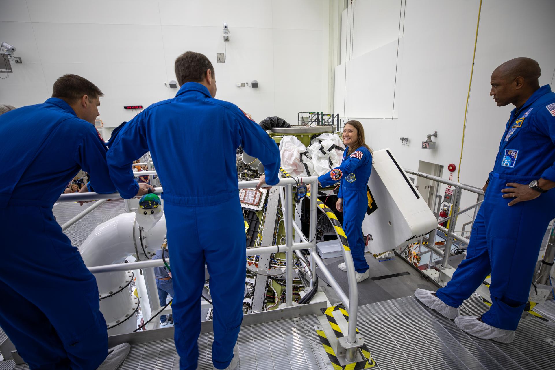 From left, Artemis II CSA (Canadian Space Agency) astronaut Jeremy Hansen, and NASA astronauts Reid Wiseman, Christina Koch, and Victor Glover view the Artemis II Orion spacecraft inside the Multi-Payload Processing Facility at NASA’s Kennedy Space Center in Florida on Wednesday, July 8, 2026. The crew returned to NASA Kennedy for their first official visit since launch of Artemis II on Wednesday, April 1, 2026, to visit with the center’s workforce and tour facilities to view progress on Artemis III prelaunch processing.