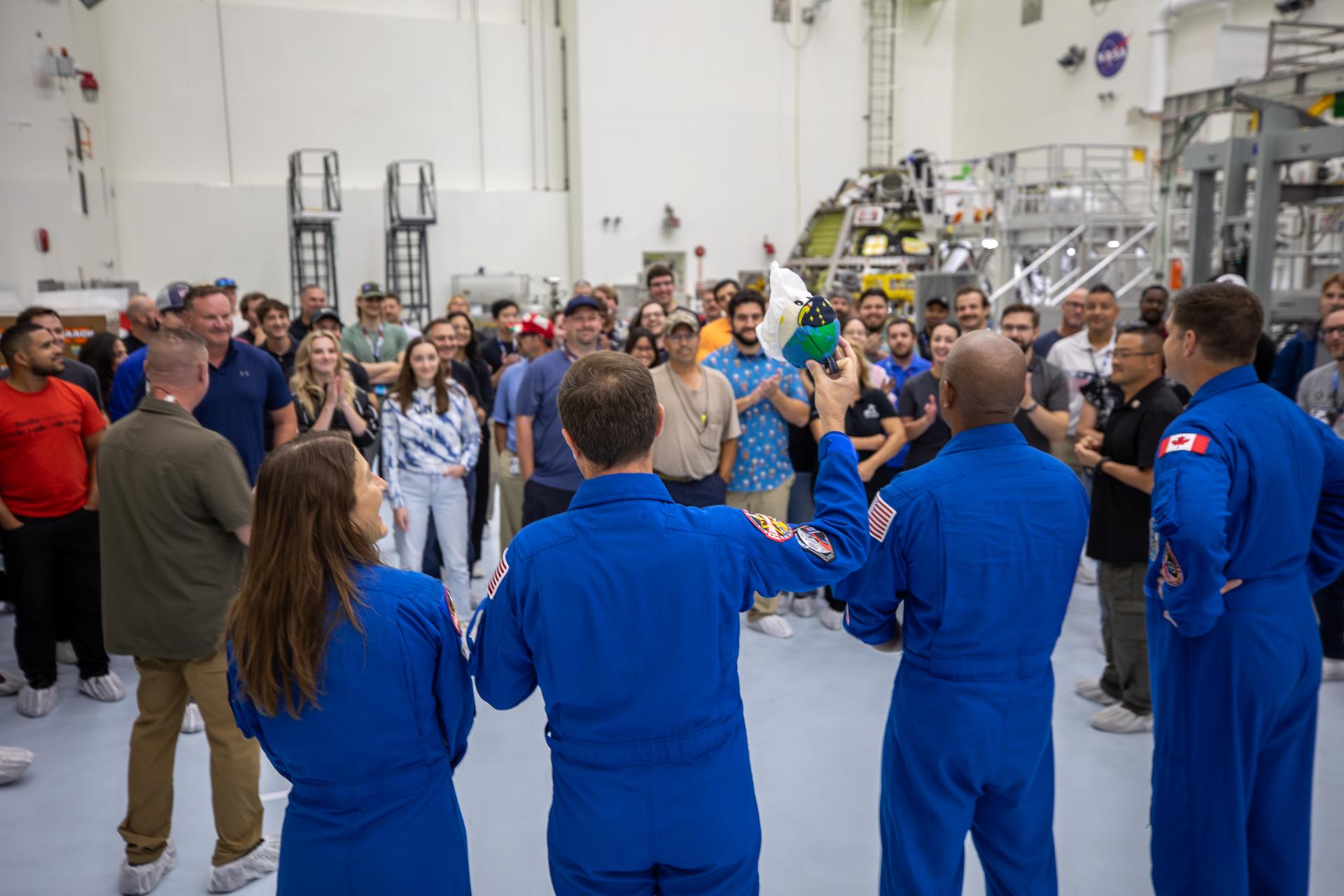 From left, Artemis II NASA astronauts Christina Koch, Reid Wiseman, Victor Glover, along with CSA (Canadian Space Agency) astronaut Jeremy Hansen speak to employees inside the Multi-Payload Processing Facility at NASA’s Kennedy Space Center in Florida on Wednesday, July 8, 2026. The crew returned to NASA Kennedy for their first official visit since launch of Artemis II on Wednesday, April 1, 2026, to visit with the center’s workforce and tour facilities to view progress on Artemis III prelaunch processing.