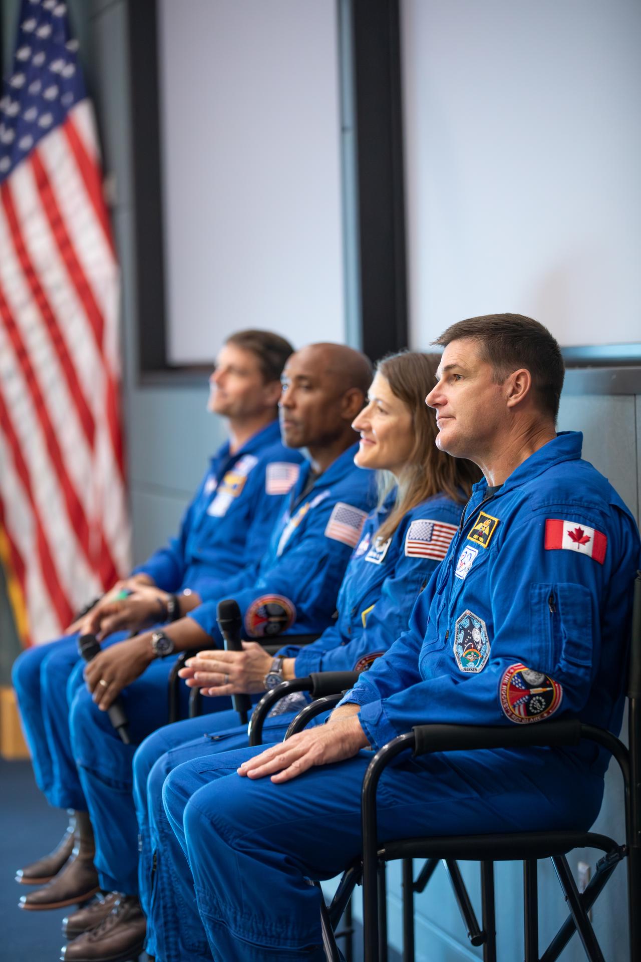 From left, Artemis II NASA astronauts Reid Wiseman, Victor Glover, Christina Koch, along with CSA (Canadian Space Agency) astronaut Jeremy Hansen speak to employees at NASA’s Kennedy Space Center in Florida on Wednesday, July 8, 2026. The crew returned to NASA Kennedy for their first official visit since launch of Artemis II on Wednesday, April 1, 2026, to visit with the center’s workforce and tour facilities to view progress on Artemis III prelaunch processing.