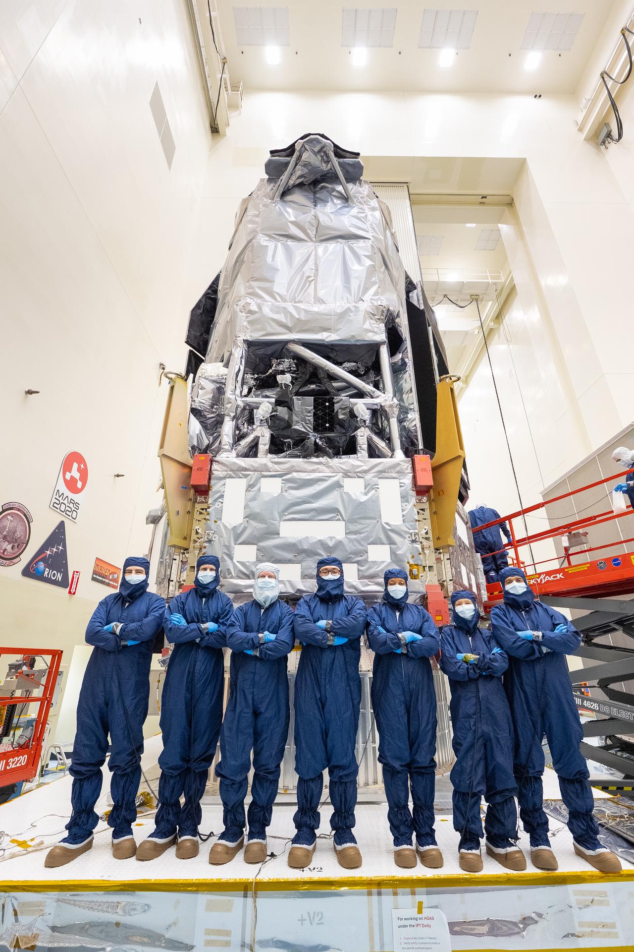 During a key integration milestone for NASA’s Nancy Grace Roman Space Telescope, technicians and engineers from the agency's Jet Propulsion Lab in Southern California gather inside the Payload Hazardous Servicing Facility at NASA’s Kennedy Space Center in Florida on Wednesday, July 8, 2026, following the closeout of the observatory’s Coronagraph Instrument test connector panel. Roman carries one science instrument called the Wide Field Instrument, and one technology demonstration called the Roman Coronagraph Instrument. The coronagraph is a system of masks, prisms, detectors, and even self-flexing mirrors built to block out the glare from distant stars and directly image the planets in orbit around them. The Roman Coronagraph will be the first active coronagraph to fly in space, meaning it contains components that actively respond to variables that would usually cause starlight to scatter, making it harder to see nearby planets.