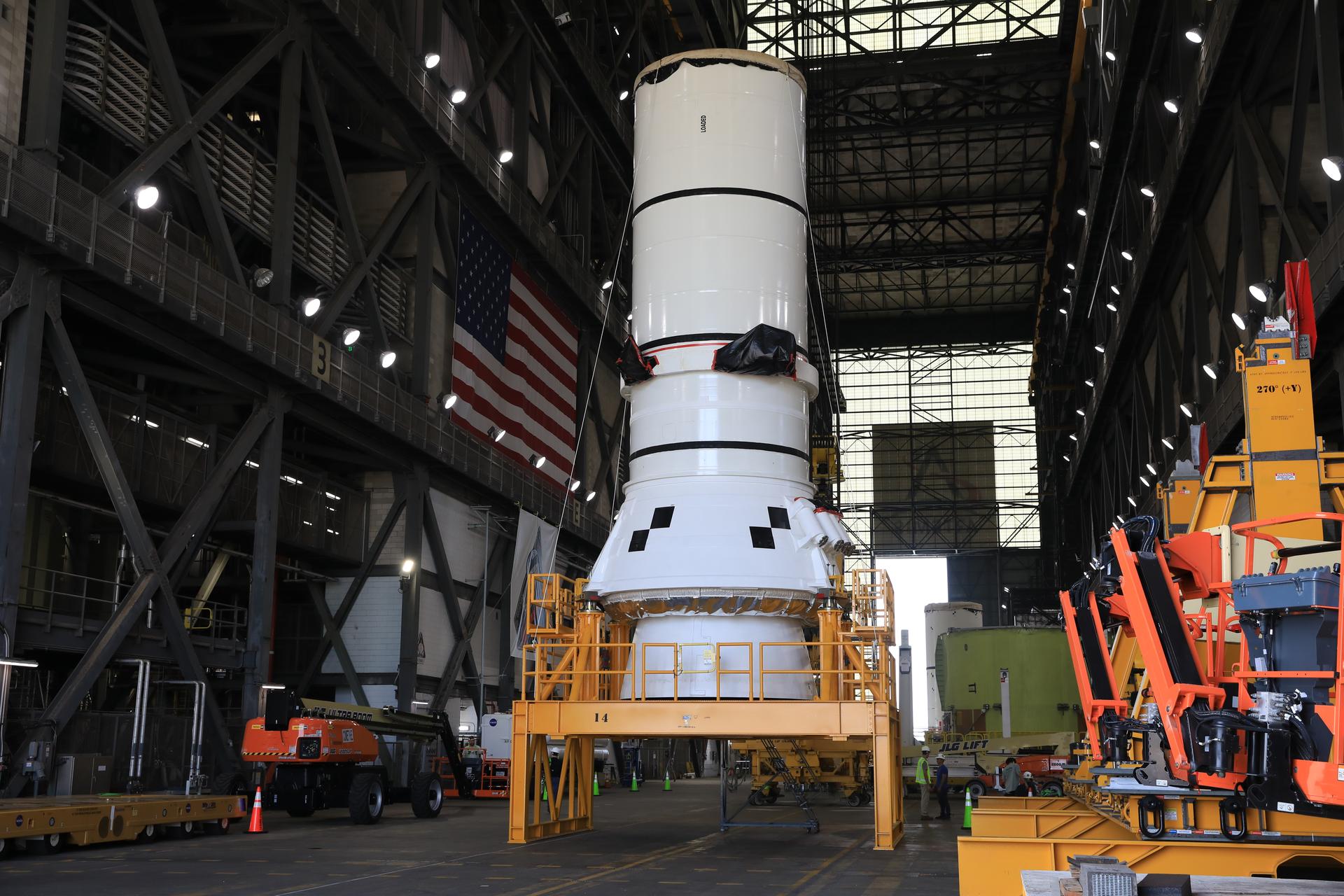 The right-hand aft assembly solid rocket booster segment for NASA’s Artemis III SLS (Space Launch System) rocket arrives at the agency’s Vehicle Assembly Building at NASA’s Kennedy Space Center in Florida on Thursday, July 9, 2026, ahead of stacking on top of the mobile launcher for the Artemis III mission. The twin boosters, manufactured by Northrop Grumman in Utah, will provide more than 75 percent of the SLS rocket’s total thrust at launch. The Artemis III mission will launch crew in the Orion spacecraft on top of the SLS rocket to test rendezvous and docking capabilities between Orion and commercial spacecraft needed to land astronauts on the Moon.