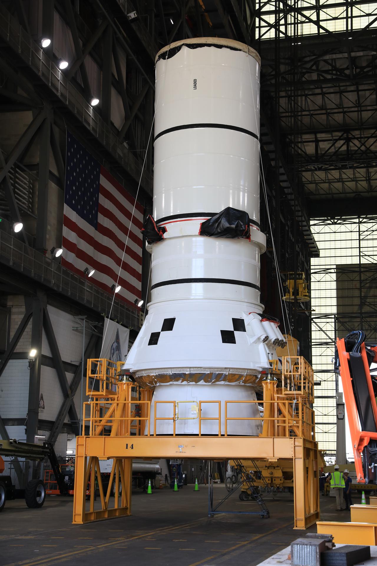 The right-hand aft assembly solid rocket booster segment for NASA’s Artemis III SLS (Space Launch System) rocket arrives at the agency’s Vehicle Assembly Building at NASA’s Kennedy Space Center in Florida on Thursday, July 9, 2026, ahead of stacking on top of the mobile launcher for the Artemis III mission. The twin boosters, manufactured by Northrop Grumman in Utah, will provide more than 75 percent of the SLS rocket’s total thrust at launch. The Artemis III mission will launch crew in the Orion spacecraft on top of the SLS rocket to test rendezvous and docking capabilities between Orion and commercial spacecraft needed to land astronauts on the Moon.