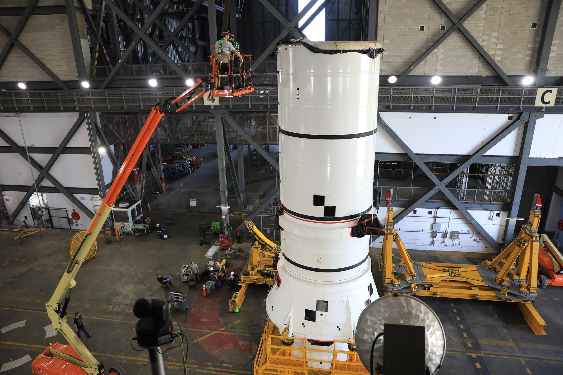 The right-hand aft assembly solid rocket booster segment for NASA’s Artemis III SLS (Space Launch System) rocket arrives at the agency’s Vehicle Assembly Building at NASA’s Kennedy Space Center in Florida on Thursday, July 9, 2026, ahead of stacking on top of the mobile launcher for the Artemis III mission. The twin boosters, manufactured by Northrop Grumman in Utah, will provide more than 75 percent of the SLS rocket’s total thrust at launch. The Artemis III mission will launch crew in the Orion spacecraft on top of the SLS rocket to test rendezvous and docking capabilities between Orion and commercial spacecraft needed to land astronauts on the Moon.