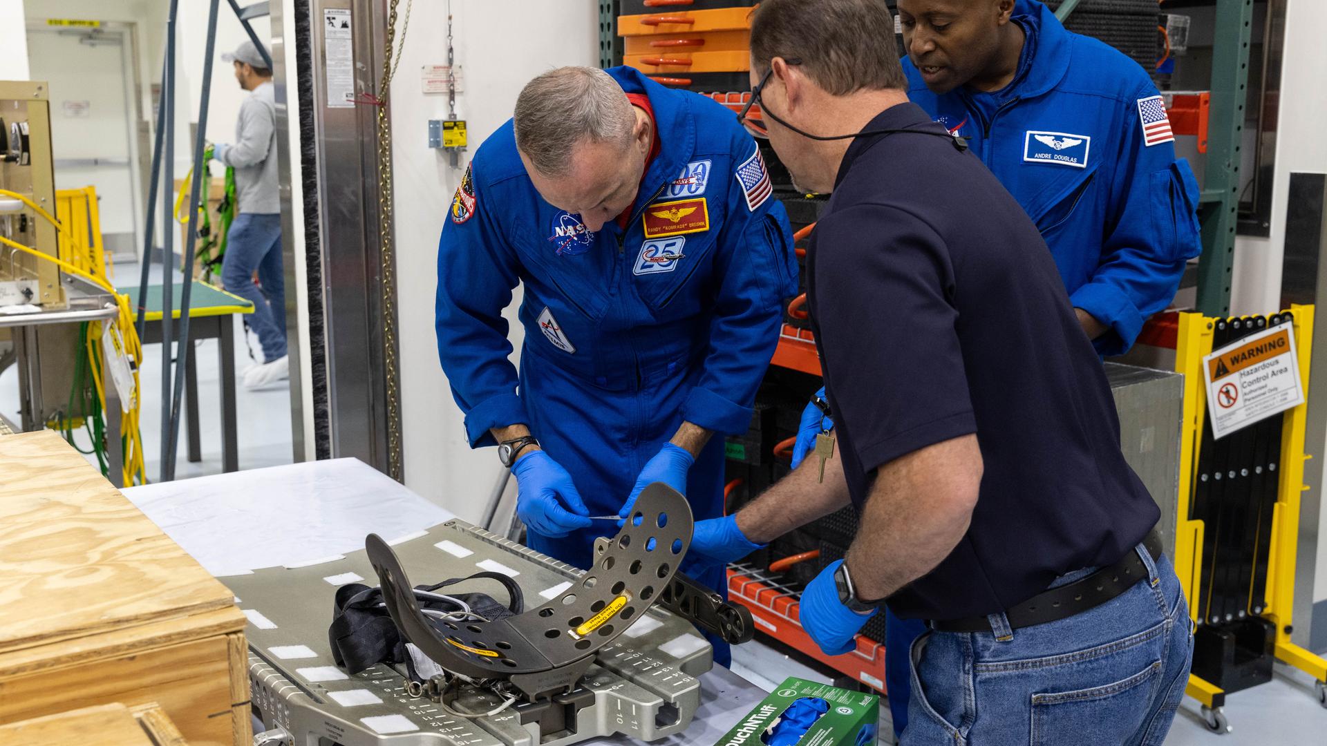 Artemis III crew members, NASA astronauts Randy Bresnick (left) and Andre Douglas get a close look Orion spacecraft hardware inside the Multi-Payload Processing Facility at NASA’s Kennedy Space Center in Florida on Friday, July 10, 2026. Bresnick, Douglas, NASA astronaut Frank Rubio, and ESA (European Space Agency) astronaut Luca Parmitano will launch aboard Orion on the Artemis III mission to conduct critical rendezvous and docking tests with lunar lander systems in low Earth orbit, advancing the capabilities needed before astronauts return to the lunar surface on Artemis IV.