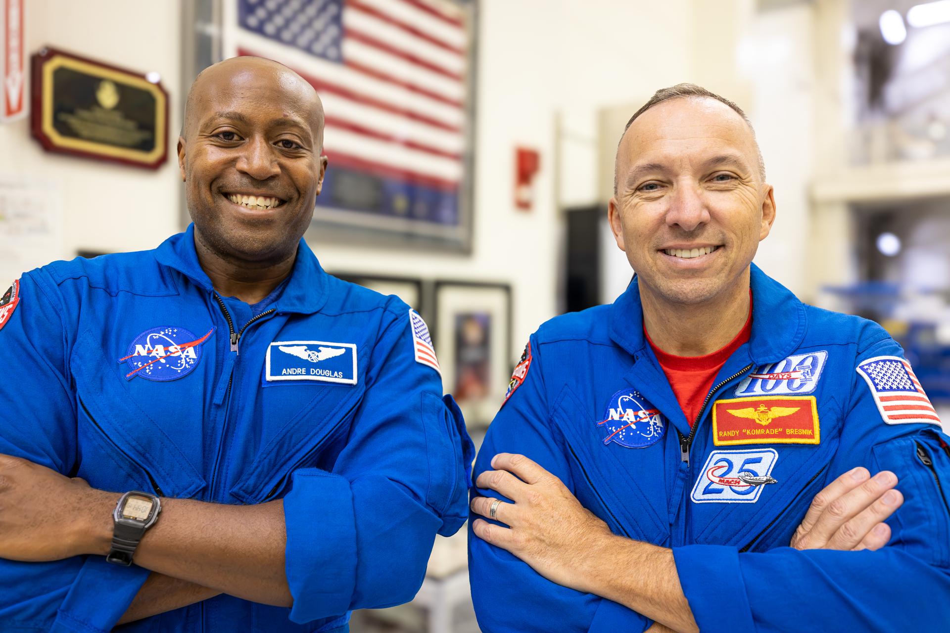 Artemis III crew members, NASA astronauts Andre Douglas (left) and Randy Bresnick, pose for a photograph inside the high bay of the Neil A. Armstrong Operations and Checkout Building at NASA’s Kennedy Space Center in Florida on Friday, July 10, 2026. The astronauts met with Orion teams and got a close look at the work underway on the Orion spacecraft inside the facility. Bresnick, Douglas, NASA astronaut Frank Rubio, and ESA (European Space Agency) astronaut Luca Parmitano will launch on the Artemis III mission to conduct critical rendezvous and docking tests with lunar lander systems in low Earth orbit, advancing the capabilities needed before astronauts return to the lunar surface on Artemis IV.