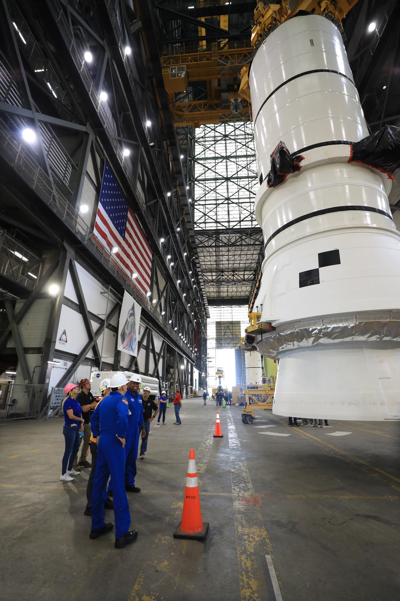 Artemis III crew members, NASA astronauts Randy Bresnick (left) and Andre Douglas, view the right-hand aft assembly solid rocket booster segment of the Artemis III SLS (Space Launch System) rocket inside the Vehicle Assembly Building at NASA’s Kennedy Space Center in Florida on Friday, July 10, 2026. The astronauts met with NASA’s Exploration Ground Systems teams and got a close look at the work underway for their upcoming mission. Bresnick, Douglas, NASA astronaut Frank Rubio, and ESA (European Space Agency) astronaut Luca Parmitano will launch on the Artemis III mission to conduct critical rendezvous and docking tests with lunar lander systems in low Earth orbit, advancing the capabilities needed before astronauts return to the lunar surface on Artemis IV.