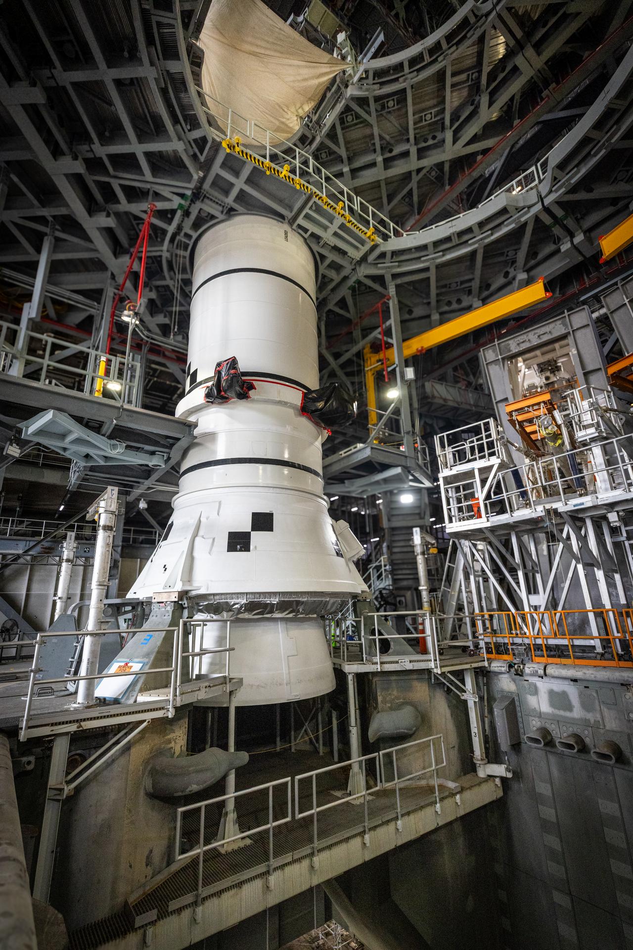 Teams with NASA’s Exploration Ground Systems Program secured the right-hand aft assembly solid rocket booster segment for the Artemis III SLS (Space Launch System) rocket to the mobile launcher at the agency’s Vehicle Assembly Building at Kennedy Space Center in Florida on Saturday, July 11, 2026. The twin boosters, manufactured by Northrop Grumman in Utah, will provide more than 75 percent of the SLS rocket’s total thrust at launch. The Artemis III mission will launch astronauts in the Orion spacecraft on top of the SLS rocket to test rendezvous and docking capabilities between Orion and commercial spacecraft needed to land astronauts on the Moon.